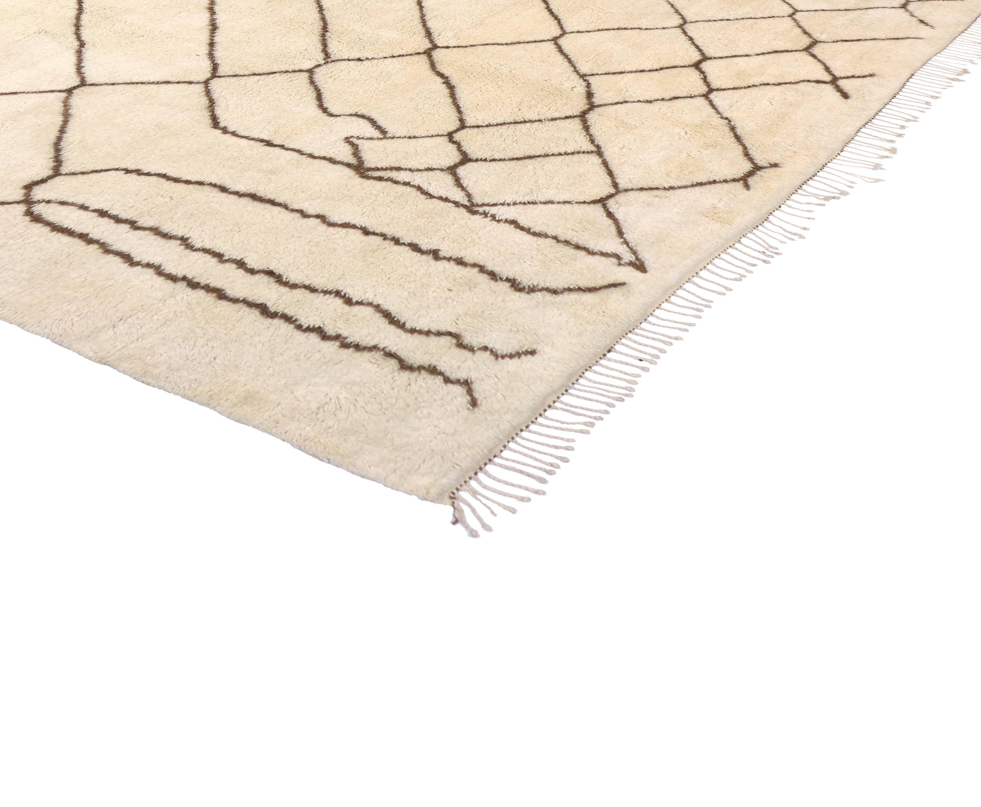 This Moroccan area rug harmonizes disparate elements, brings soothing serenity while adding texture and depth to your space. This is a wonderful example of a Moroccan rug, woven with a clean and simple, yet sophisticated composition. The off white,