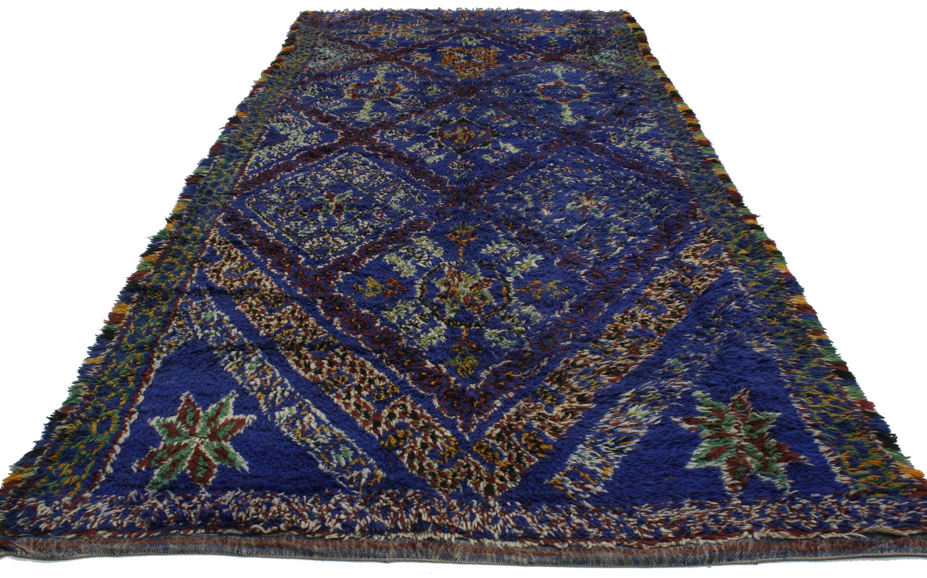 Featuring a saturated palette of cobalt blue, this plush piled Beni Ourain carpet will transform a plain room into a lively space. Giving a youthful and whimsical feel with its tribal motifs, Moroccan rugs can add much-needed color, warmth and