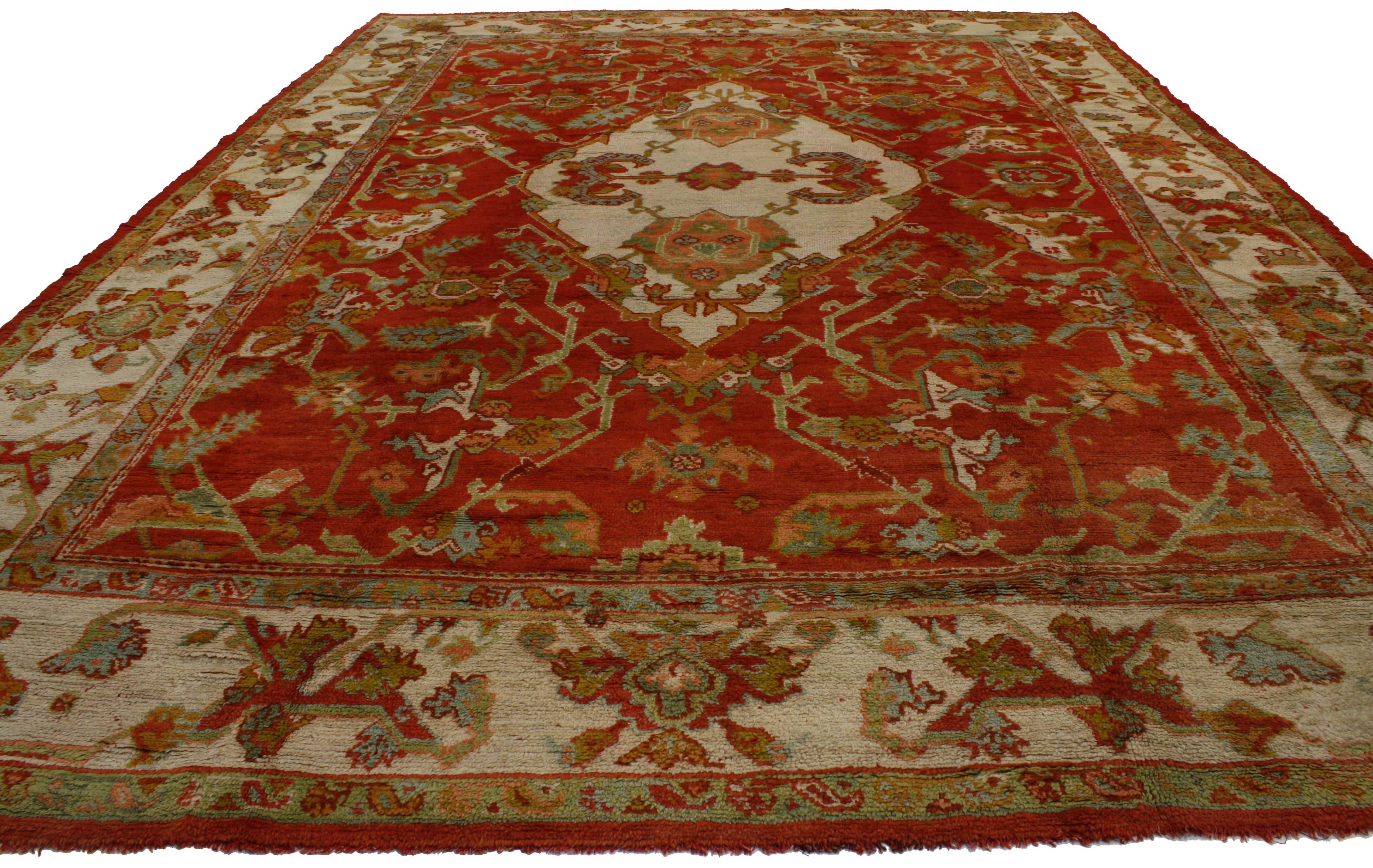 76656 Antique Turkish Oushak Rug with Traditional Modern Style. This hand-knotted wool antique Turkish Oushak rug is made with vibrant and festive tones. The presence of deep crimson red, light teal blue, spring green and cream colors come together