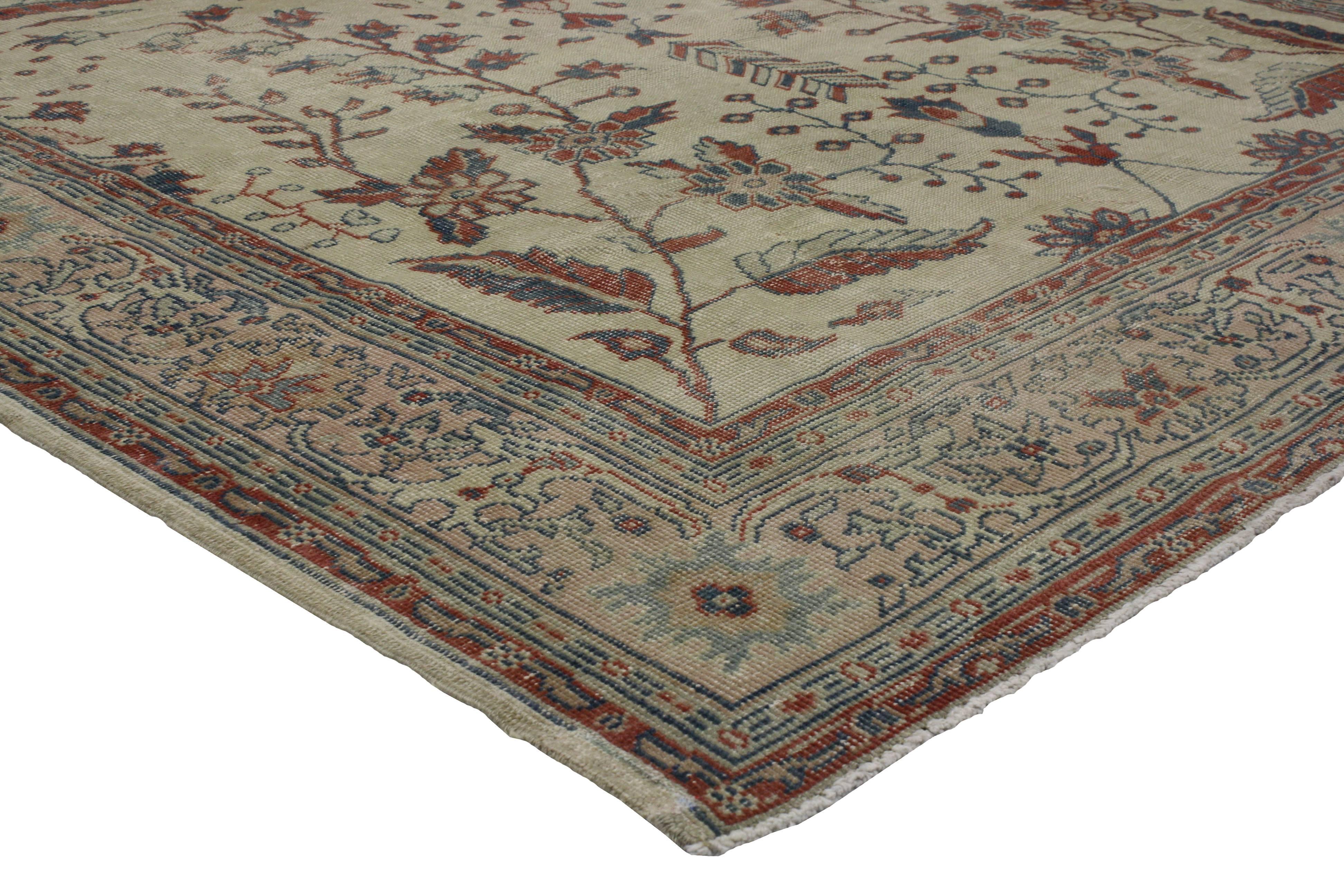 Here is a beautifully woven vintage Turkish Sivas rug, highlighting classical elements that are reminiscent of Persian design. The field boasts a regal pattern of rectilinear florals, blossoms, leaves, vines and palmettes in variegated shades of