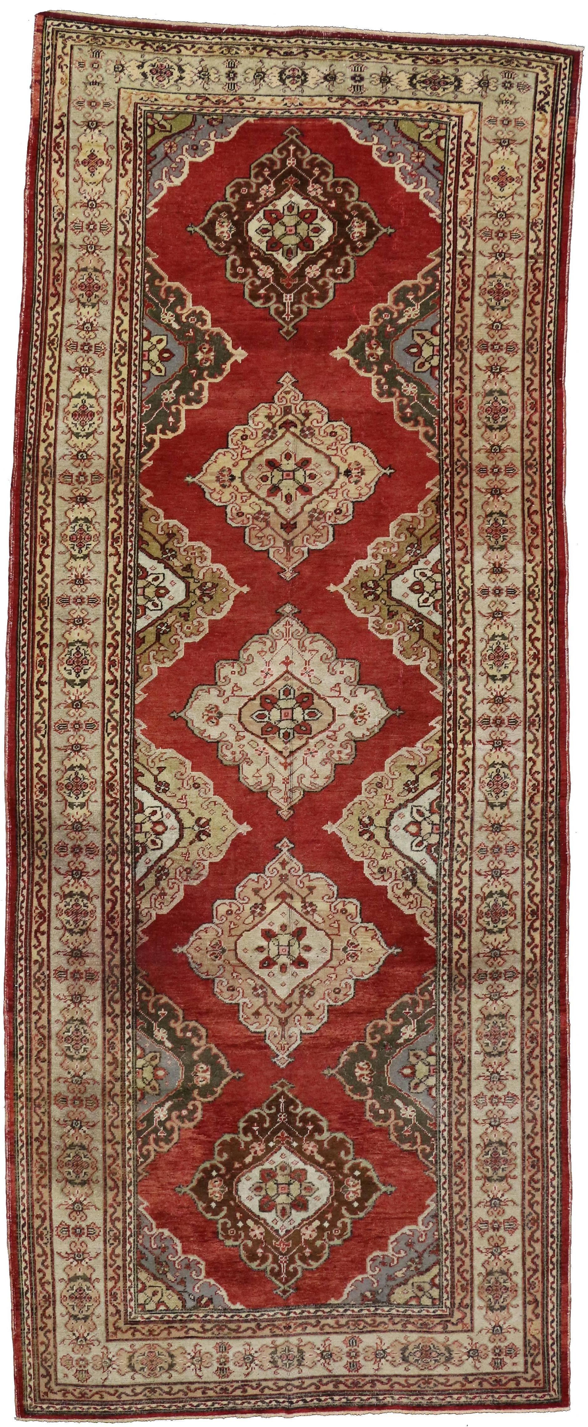 50588-50589 Pair of Vintage Turkish Oushak Carpet Runners with Traditional Modern Style. Remarkable in style and scale, this pair of vintage Turkish Oushak carpet runners feature a traditional modern style rendered in variegated shades of rust, red,