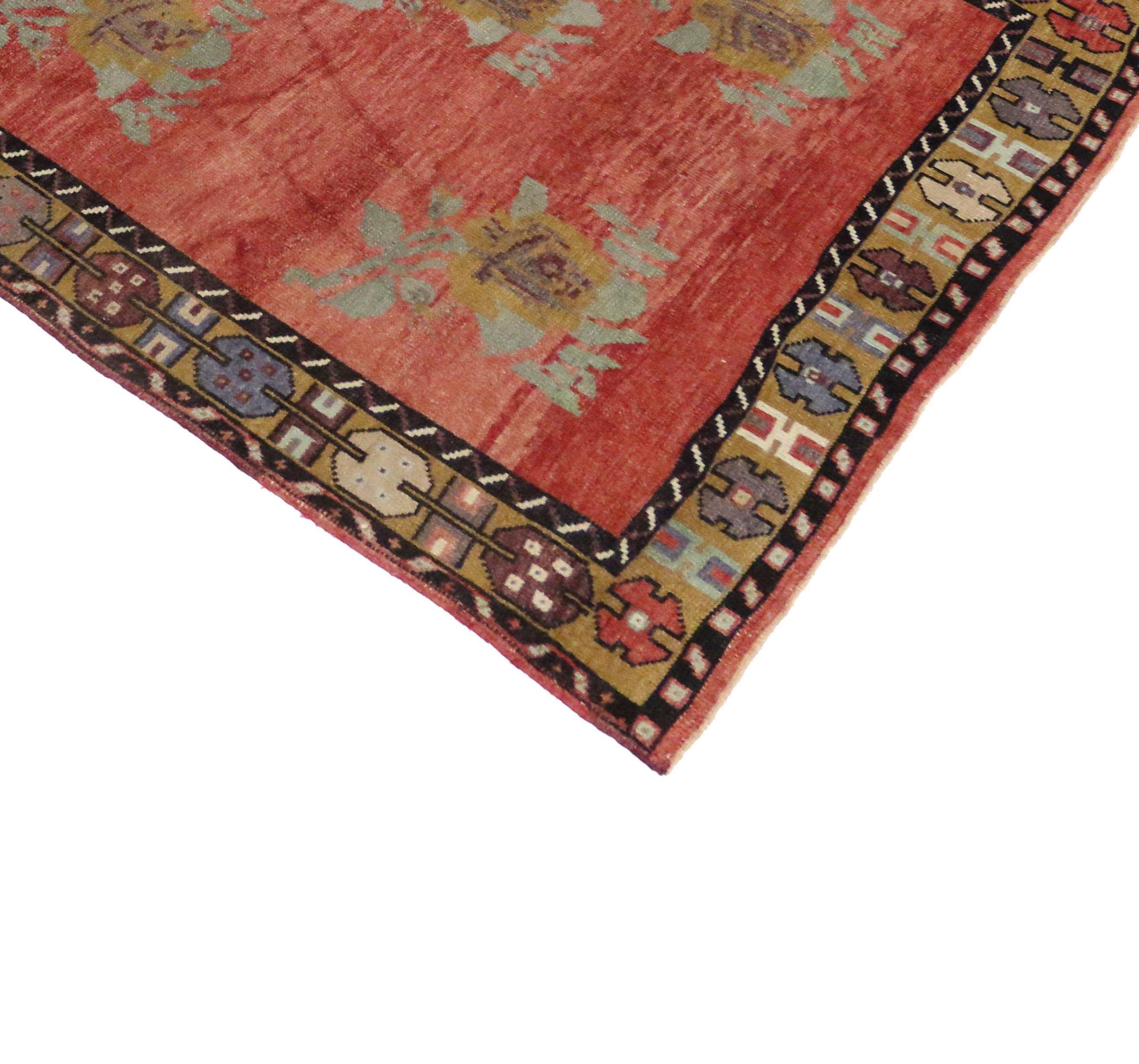 51362 Vintage Turkish Oushak Hallway Runner with English Country Cottage Style. Boasting a floral bounty in a range of warm hues, this hand-knotted wool vintage Turkish Oushak runner is a delightful example of English Country Cottage style. The