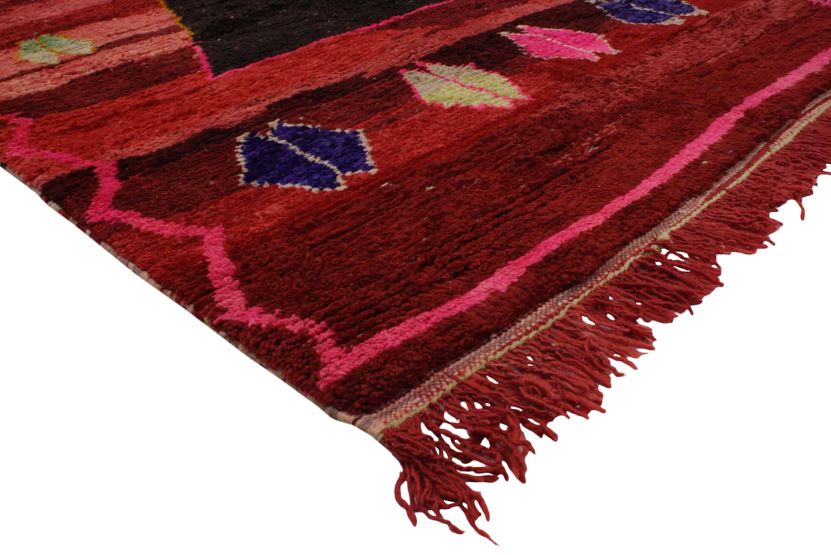 Highly stylish yet casually elegant, this boho chic Berber Moroccan rug with a contemporary abstract style is ideal for nearly any stylish space. Features a large black triangle surrounded by Berber Tribe motifs on an abrashed red field. This tribal