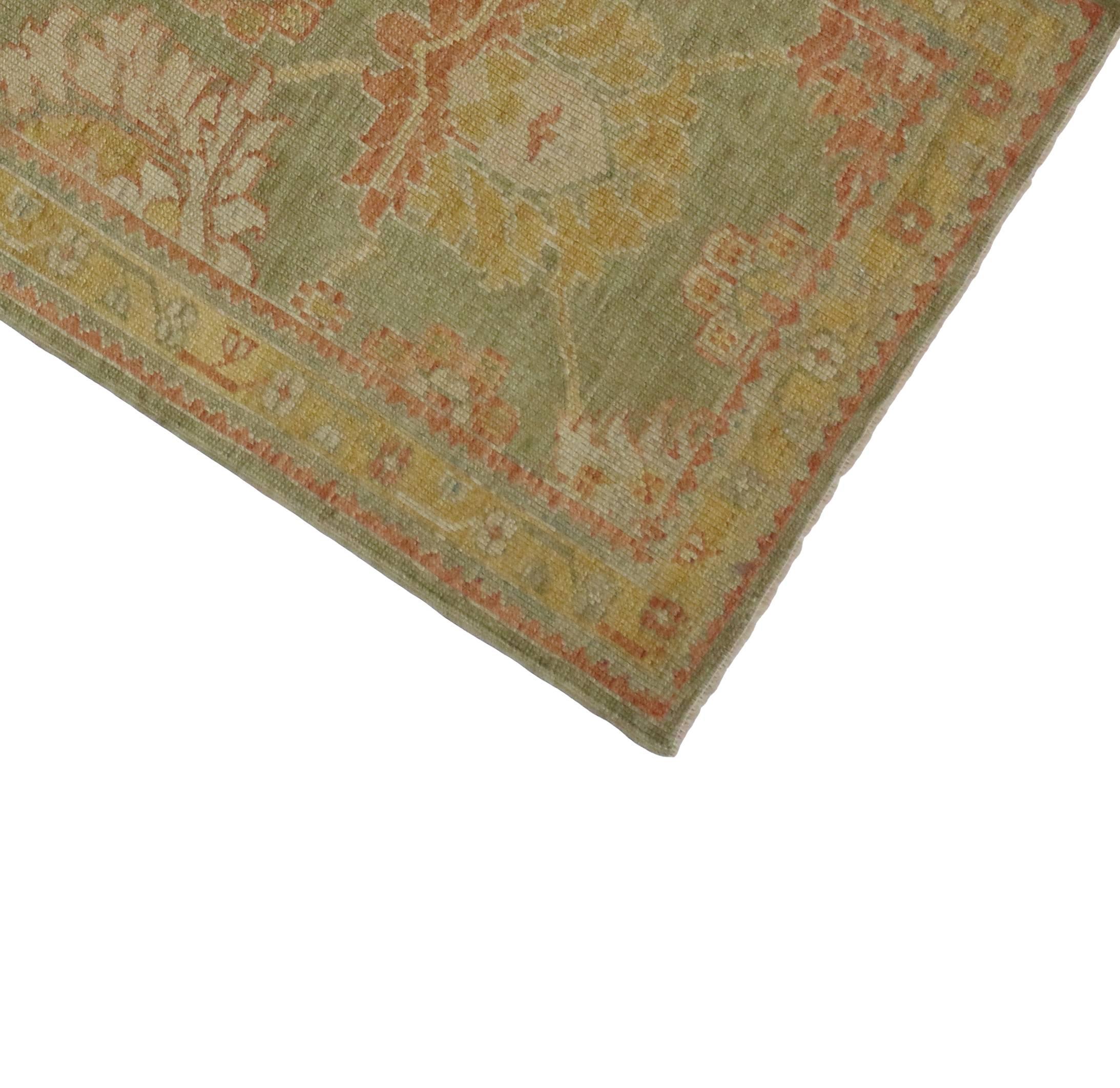 Add character to your space with the look of age in this contemporary green Oushak runner featuring a modern traditional style. Green is always a great color to decorate with because of its versatility. Soft spring greens, rustic orange, golden