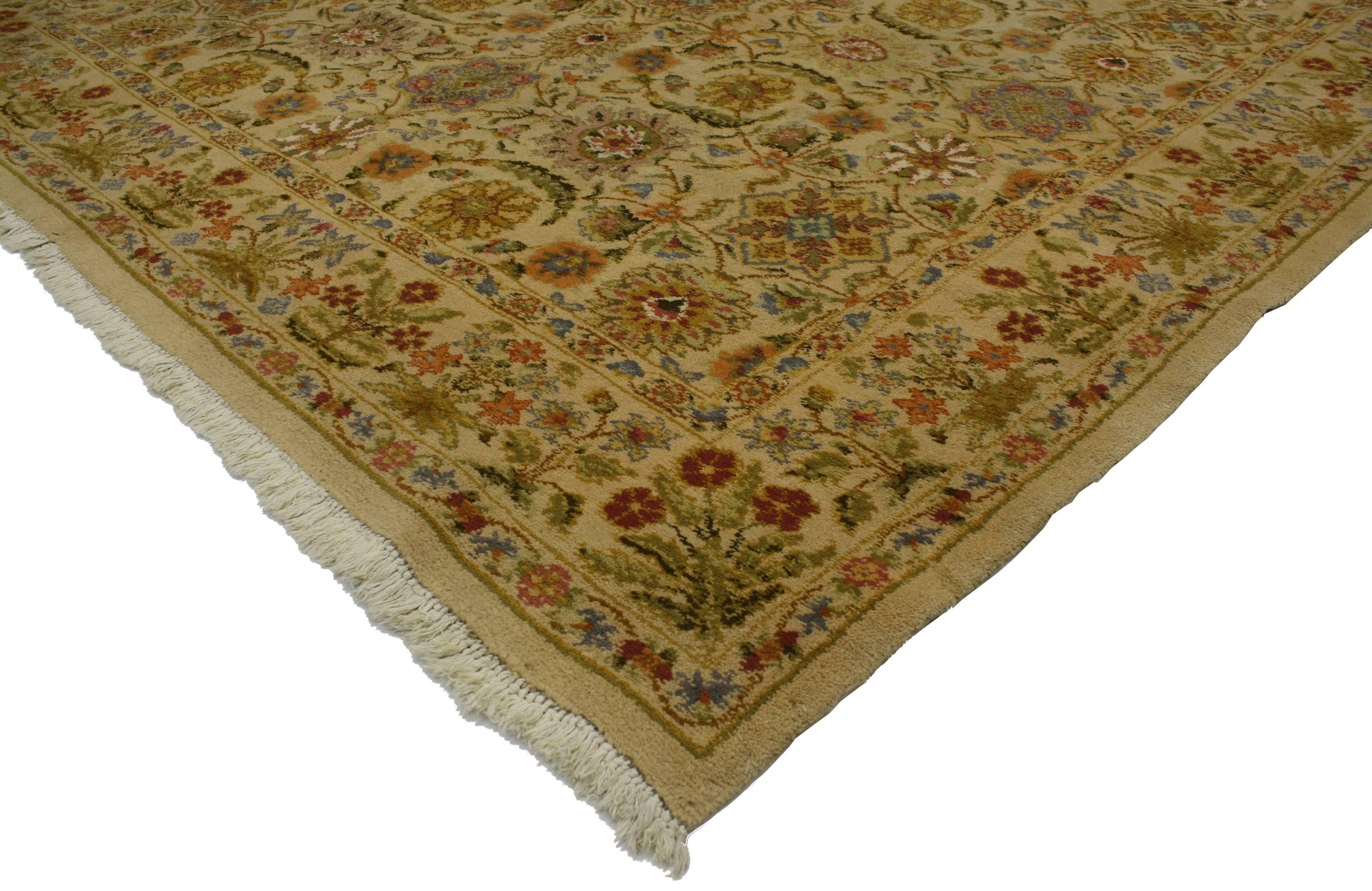 This vintage Spanish golden color rug features a modern traditional style. Displaying an allover floral and botanical pattern surrounded by a complementary border. Made in the mid-20th century, this vintage Spanish rug can be a wonderful complement