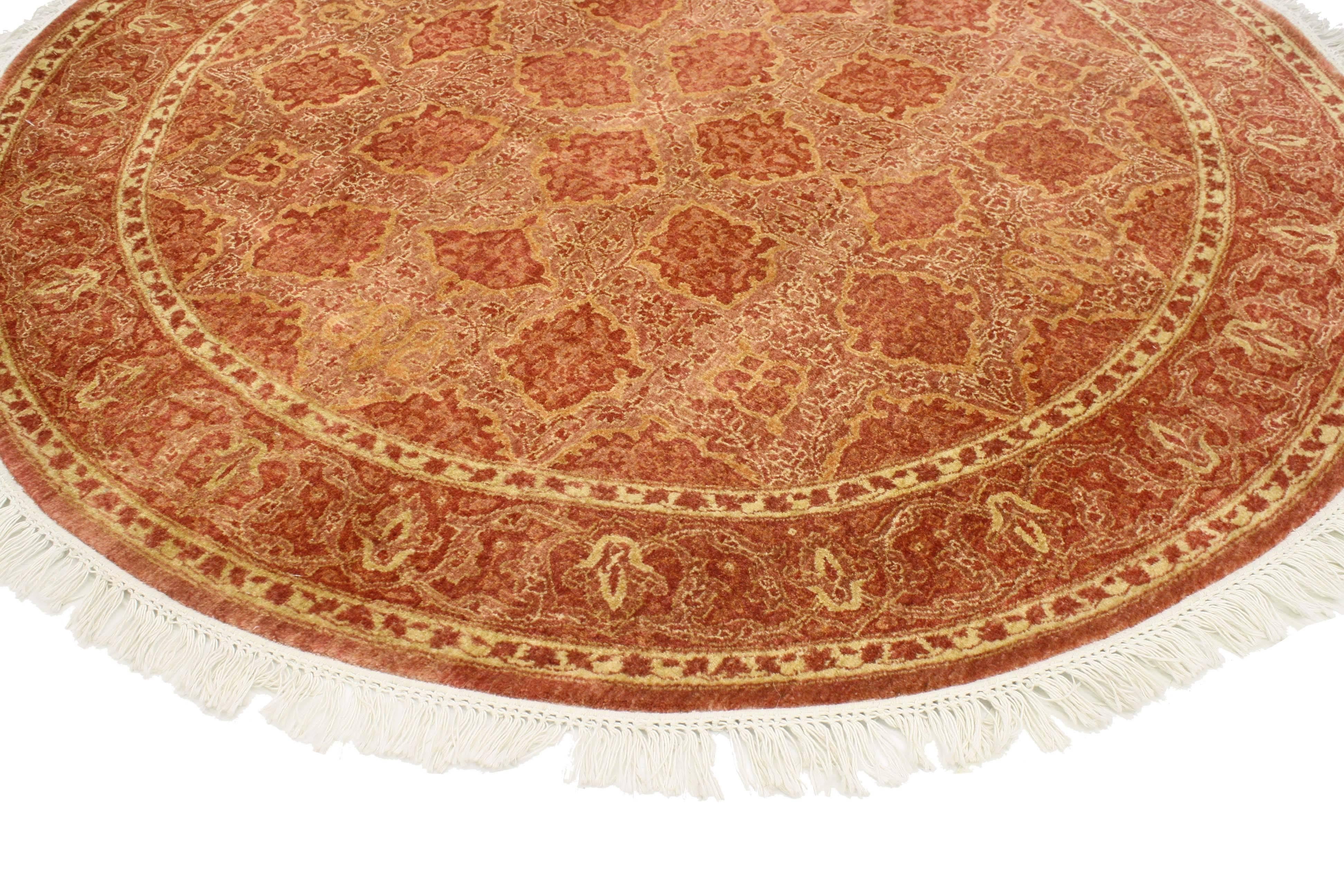 The warm spice tone colors combined with the eye-catching geometric pattern of this modern Indian round rug with transitional style make a major statement without visually overwhelming the rest of the room. The rich hues of Indian spices makes it