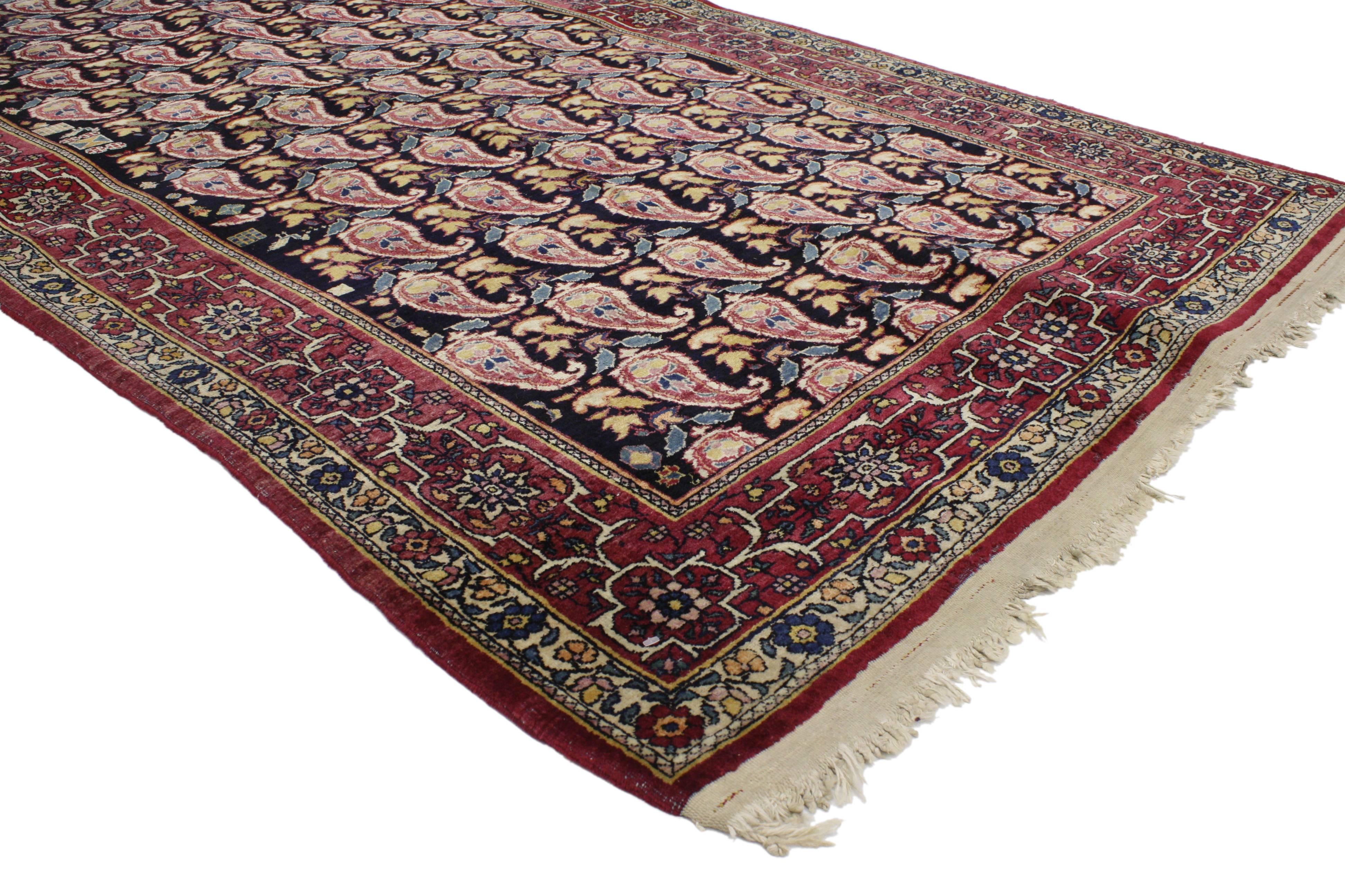 76946 Distressed Antique Persian Kerman Rug with All-Over Boteh Pattern 04’01 x 08’11. Modest yet full of character, this antique Kerman (Kirman) rug with traditional modern design displays an all-over repetitive pattern of symbolic boteh motifs.