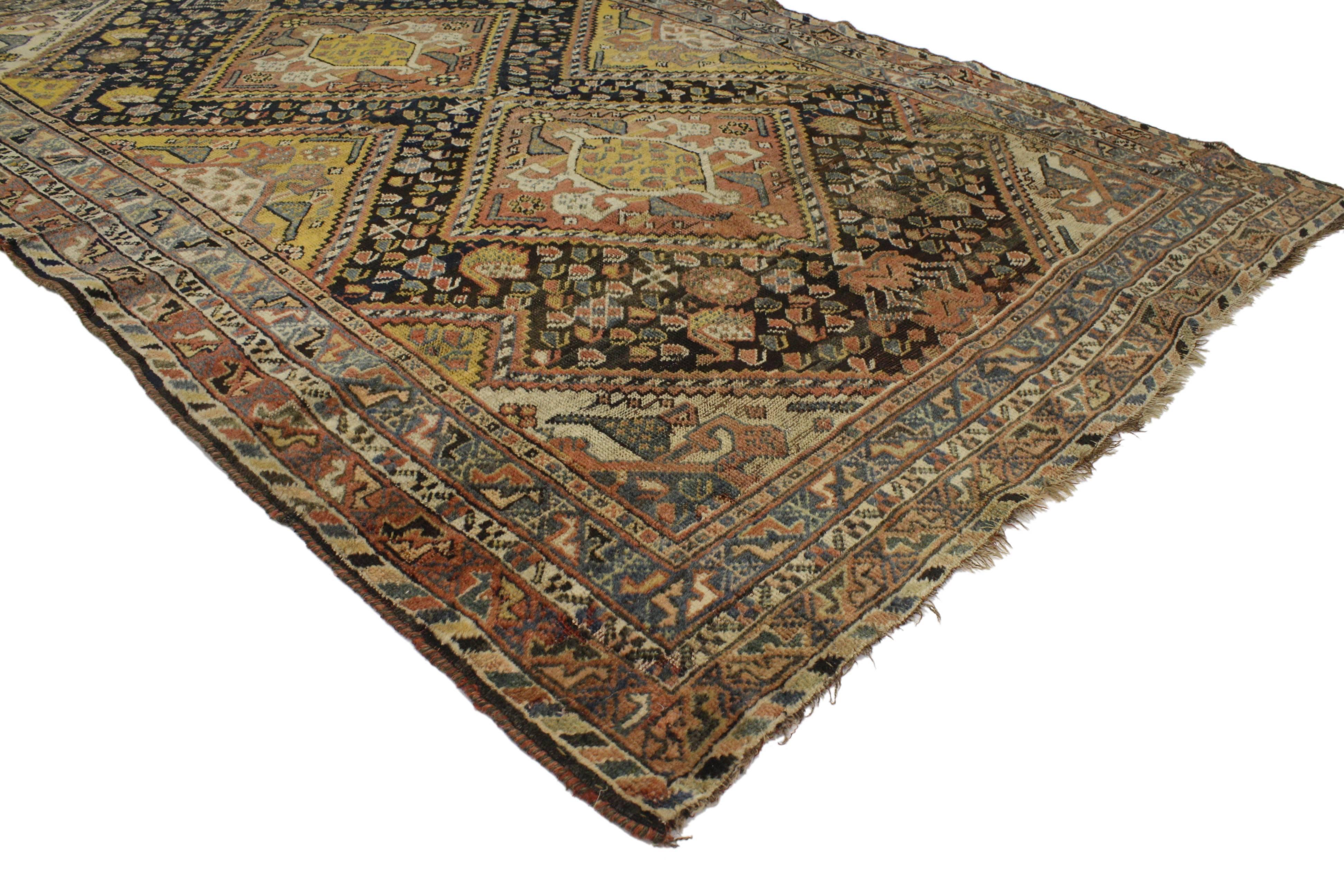 With a classic design and timeless style, this antique Persian Shiraz rug features modern tribal style. With its intimate patina and rich waves of abrash, this antique Persian Shiraz rug has such an elegant feel, the warm brown feels fresh and the