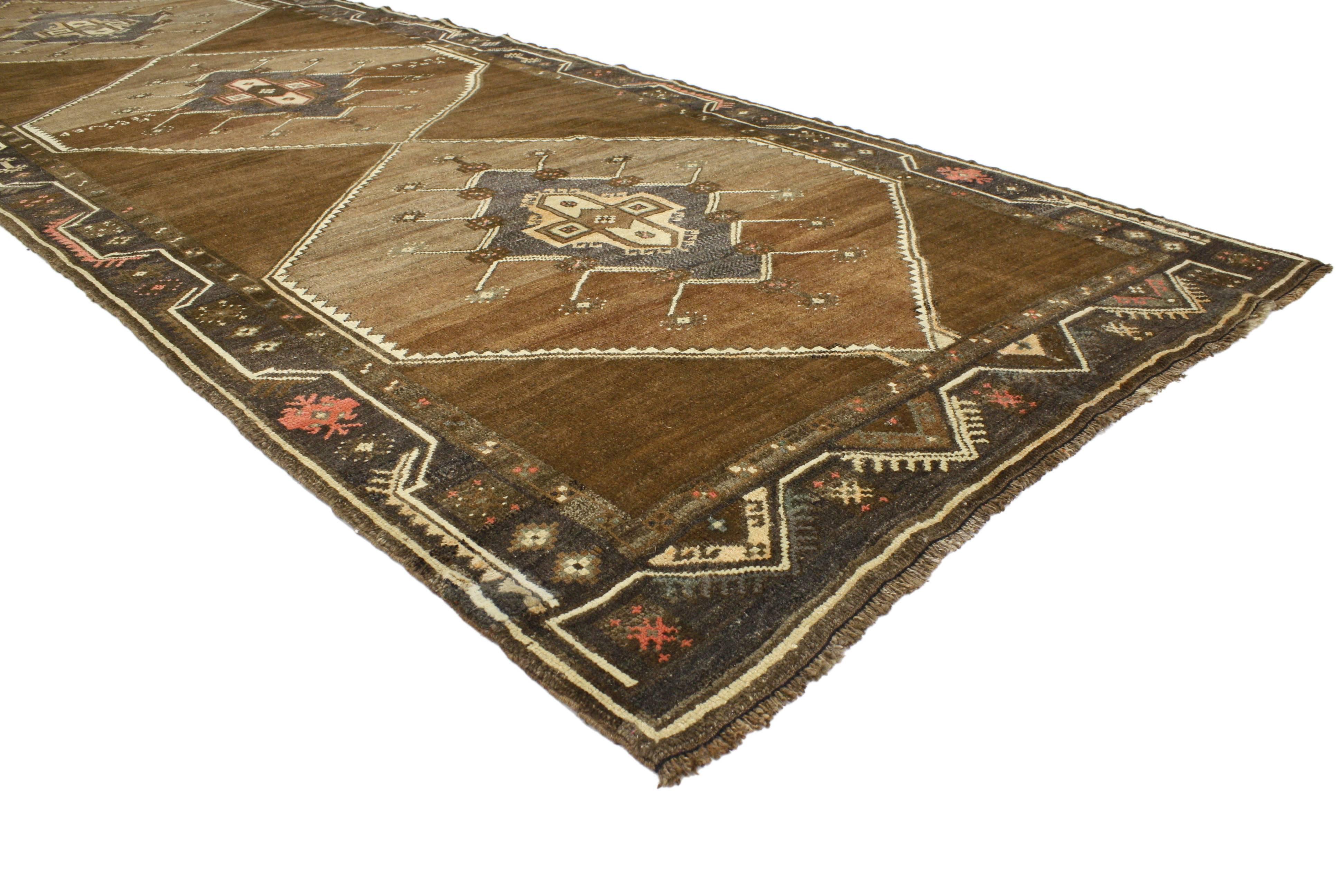 76968 Vintage Turkish Oushak Runner with Mid-Century Modern Style, Wide Hallway Runner. This hand-knotted wool vintage Turkish Oushak runner with Mid-Century Modern style features three stacked hexagonal medallions with an inner saw-tooth outline.
