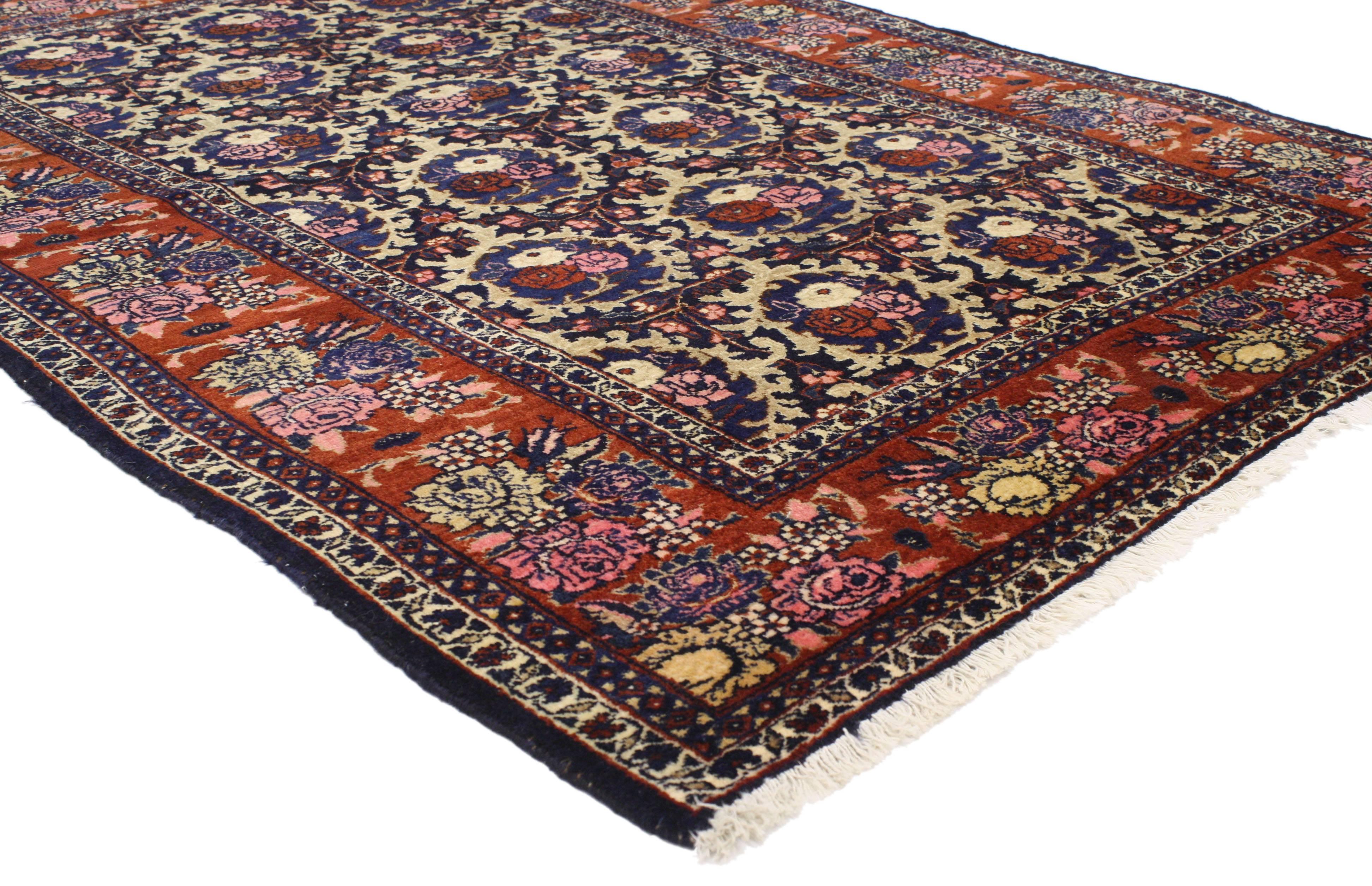 77012 Antique Persian Bijar Rug with Traditional Style and Floral Compartment Design 04'09 x 06'06. This hand-knotted wool antique Persian Bijar rug features an elaborate all-over floral compartment design spread across an ink blue field. The