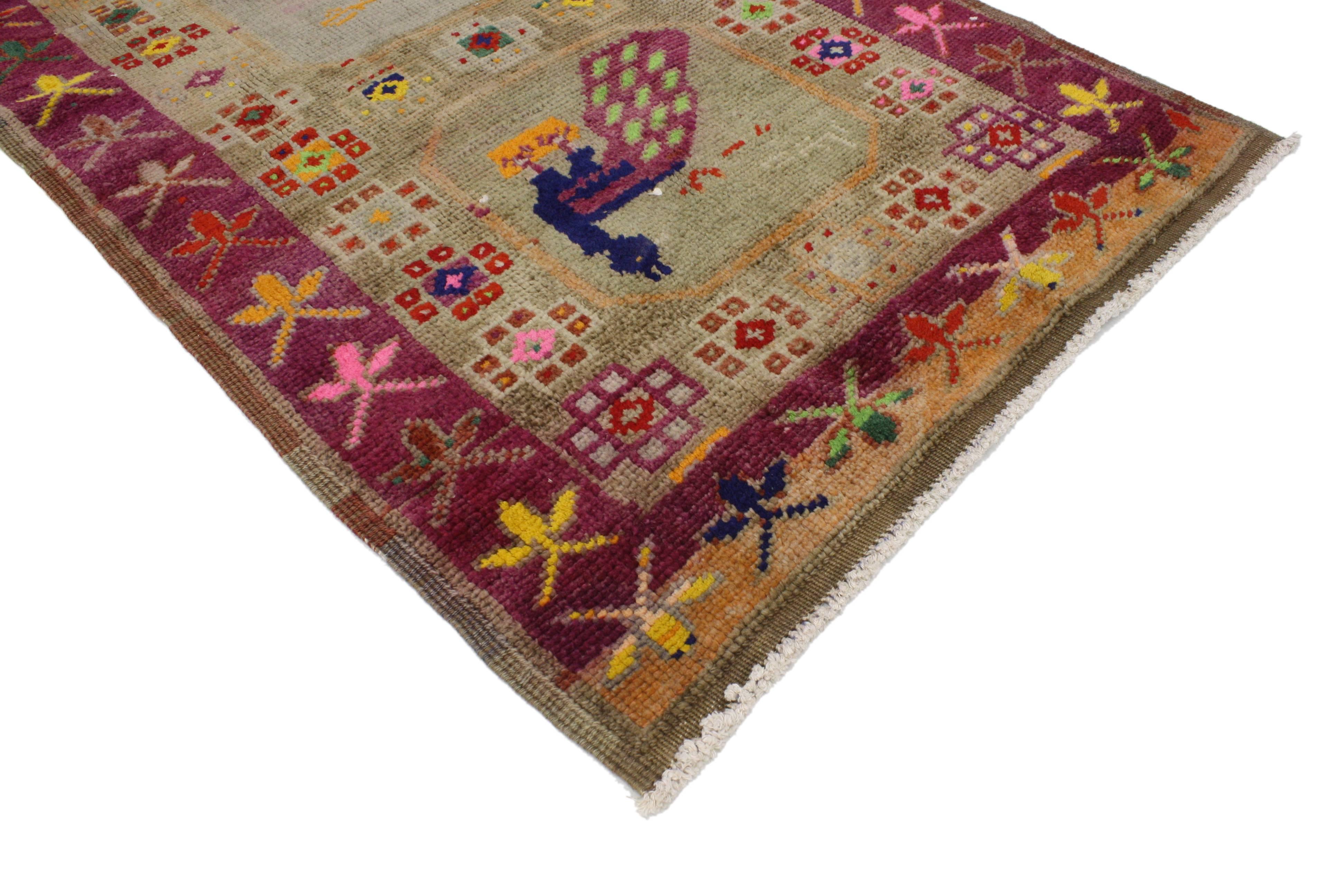 This highly desirable vintage Turkish Oushak runner with modern tribal style features a row of 7 compartments filled with peacocks illuminating its lively, composition. Robust waves of abrash sweep across the abrashed field, enhancing the depth to