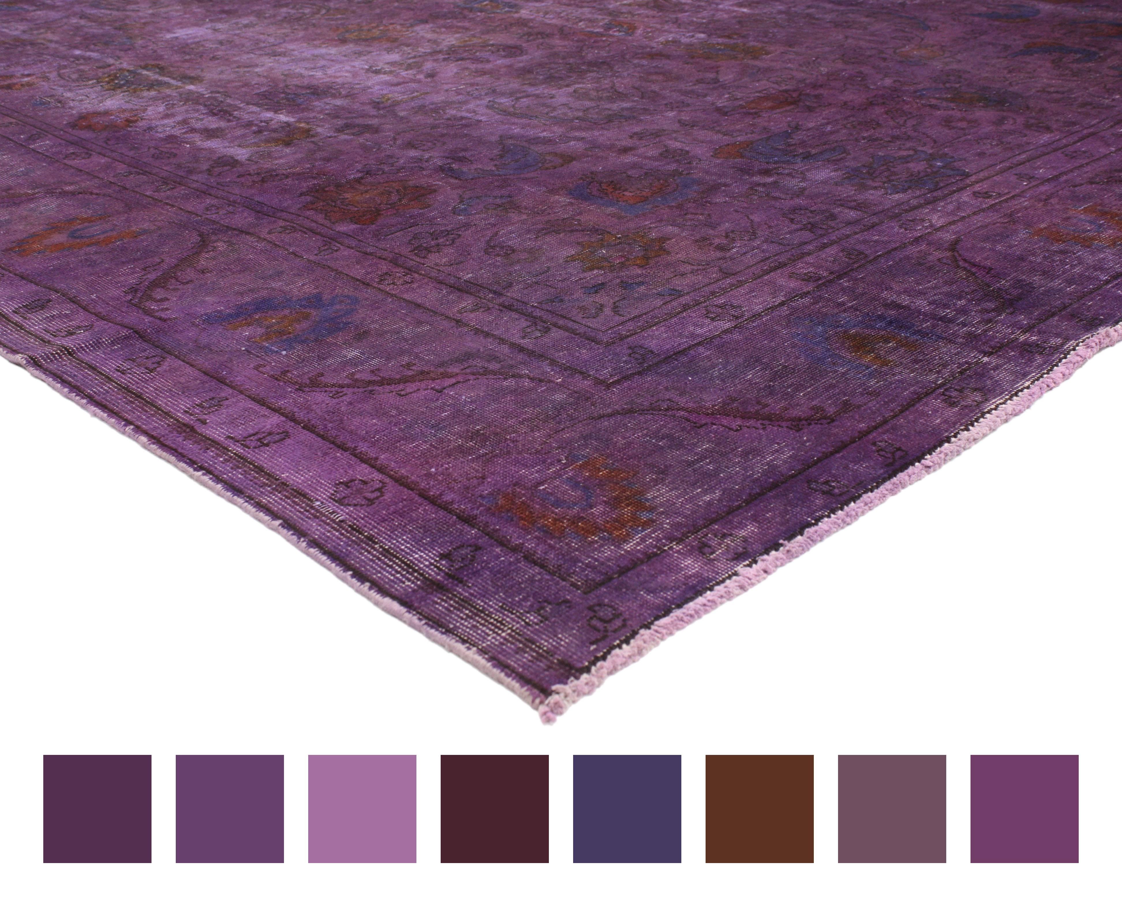 This beautifully composed distressed overdyed violet purple Persian rug with postmodern Memphis style features an allover geometric floral pattern. Saturated with variegated shades of purple bring a fashion-forward presence when combined with its