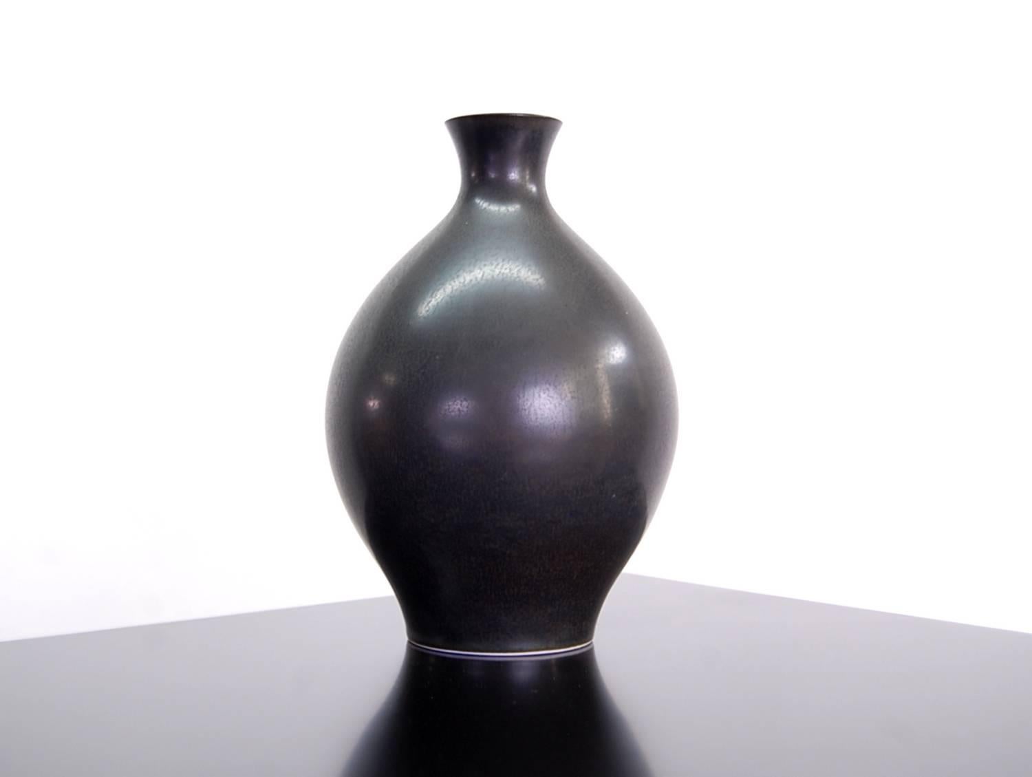 Porcelain vase by Carl-Harry Stålhane (signed CHS) for Rörstrand, Sweden, circa, 1960.

We offer free delivery on most of our items within the long Island or greater NYC, Northern New Jersey and New England areas. Please inquire for further