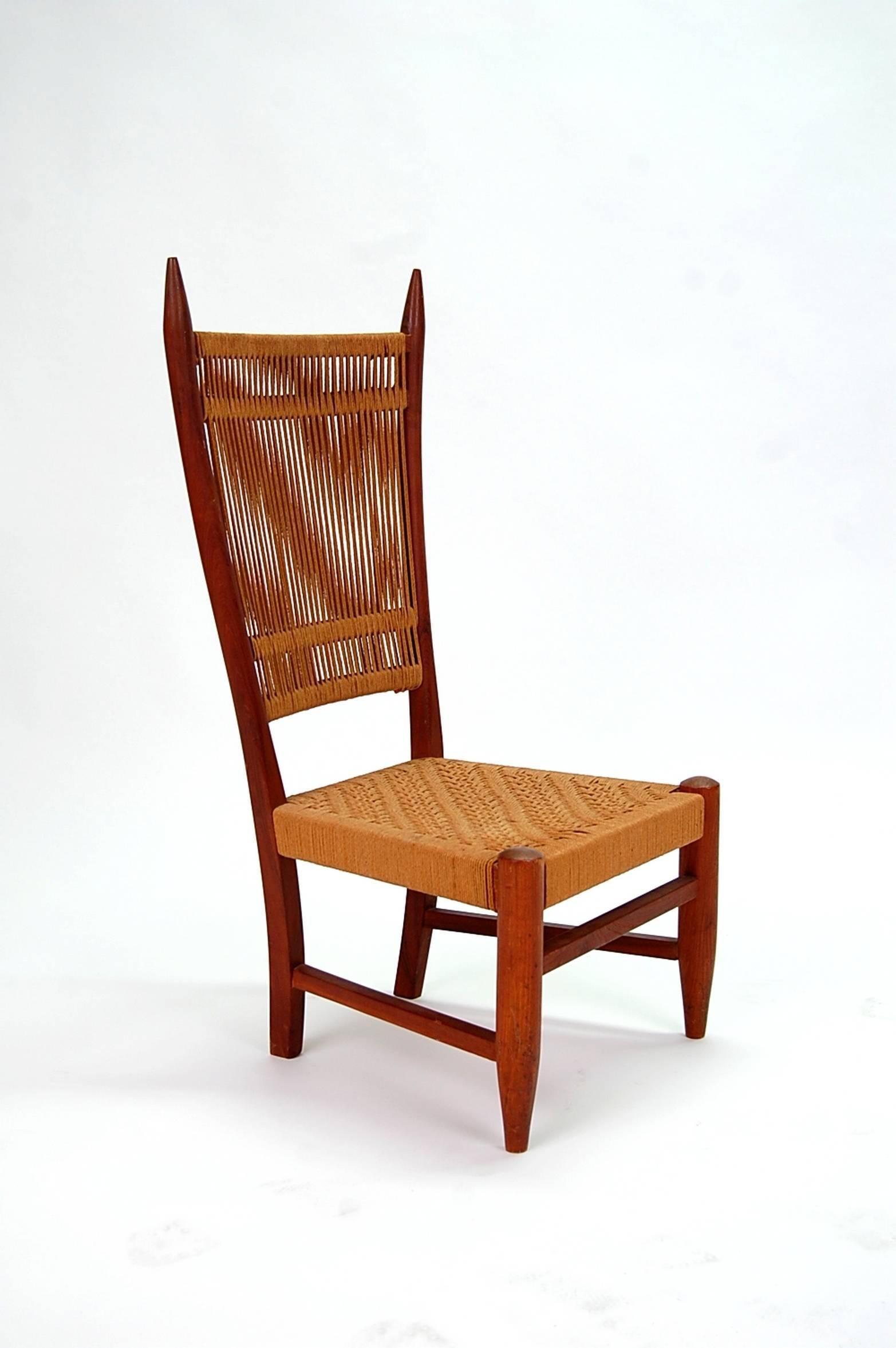 Diminutive Scandinavian chair in teak with string back and seat, circa 1960s.

We offer free delivery on most of our items within the Long Island or greater NYC, Northern New Jersey, and all of New England. Please inquire for further details. We