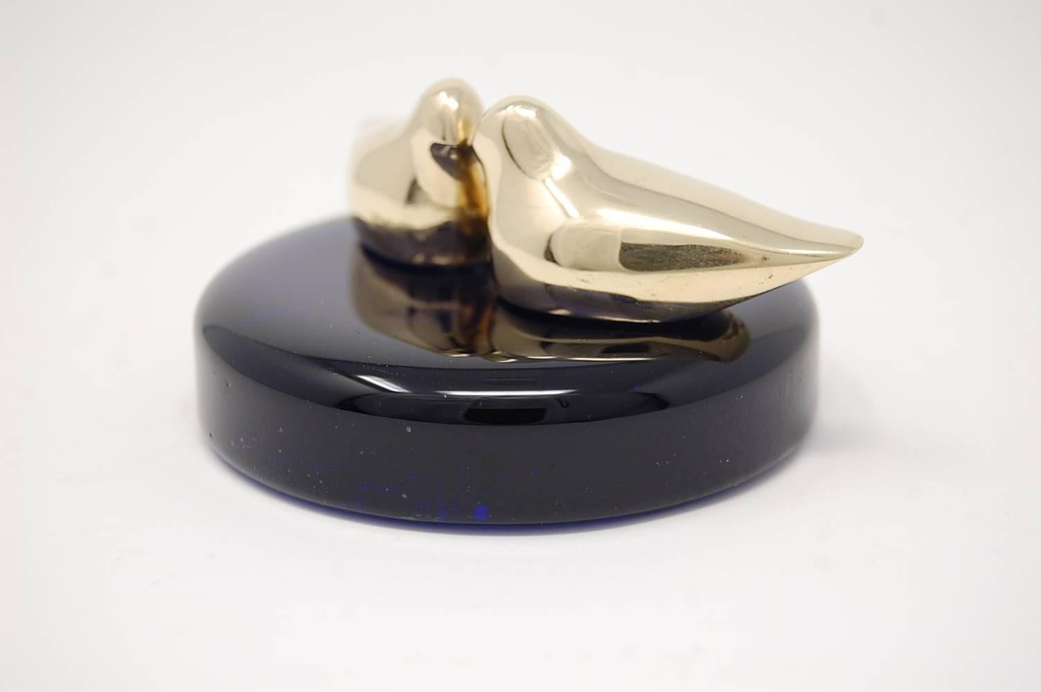Paperweight of cobalt blue glass, and pair of bronze birds, attributed to Tapio Wirkkala for Kultakeskus Oy, circa 1968, Finland.

We offer free delivery on most of our items within the Long Island or greater NYC, Northern New Jersey, and all of