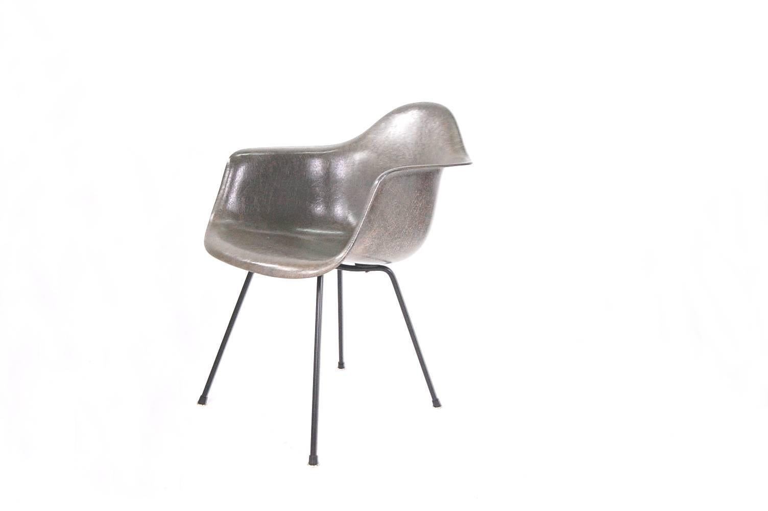 Early rope edge armshell chair, designed by Charles Eames, and produced by Zenith Plastics of California for Herman Miller.  Base has been refinished in a satin black, and has brand new boot glides. Partial label intact. Beautiful sheen and