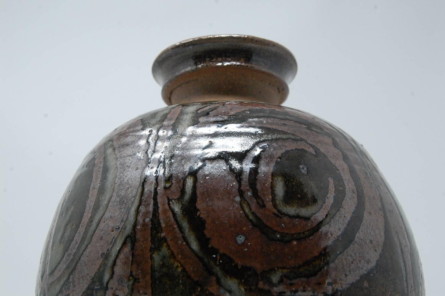 Large bulbous studio pottery vase by New Hampshire master potter Gerry Williams. Executed, circa 1970s. Incised signature and cypher.


* Free shipping at full price only.