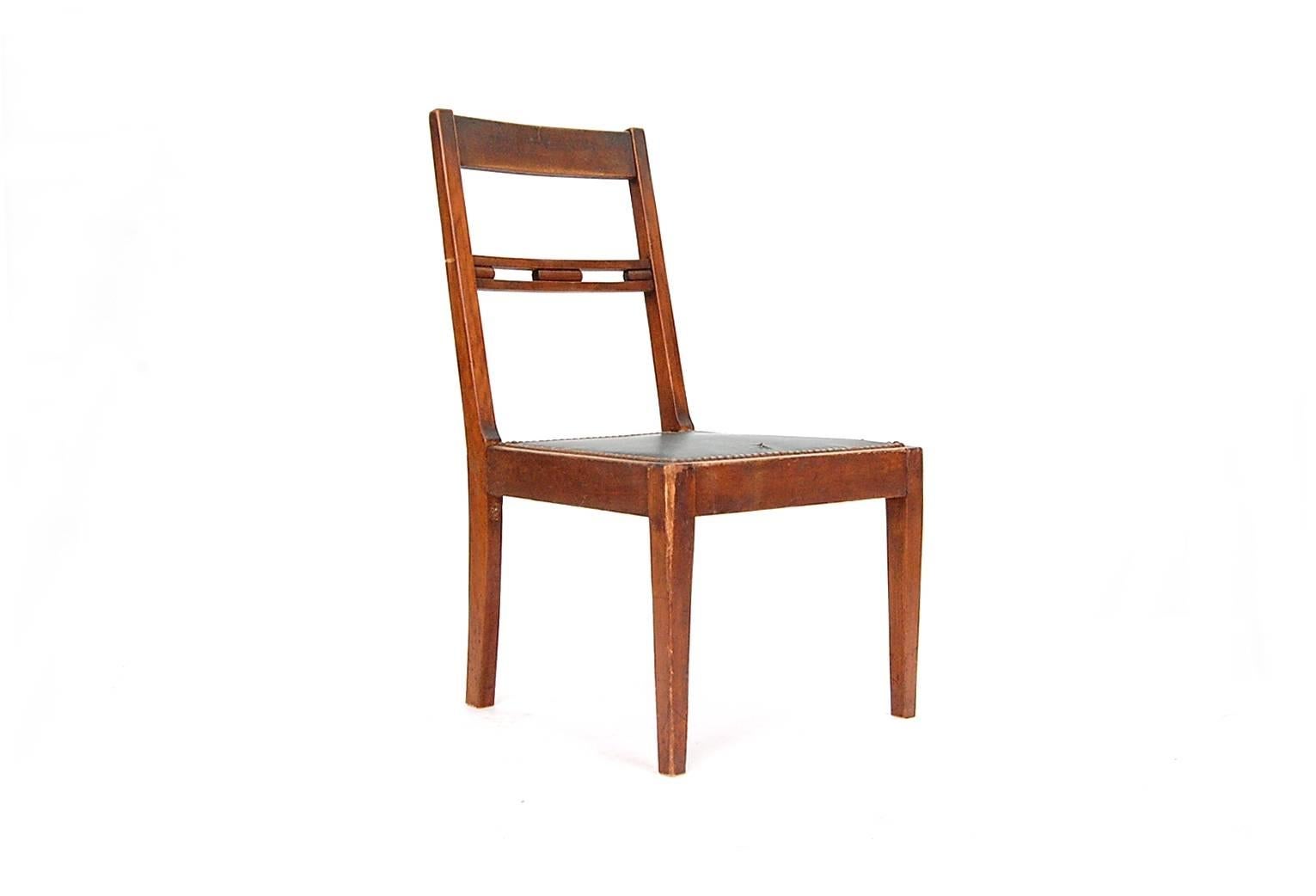 Very rare chair by Francis H. Bacon (1856-1940), circa 1910-1915. The splat, although it appears to be five elements, is actually one exquisitely carved piece of walnut. Although this chair is not true arts and crafts, I would definitely say that