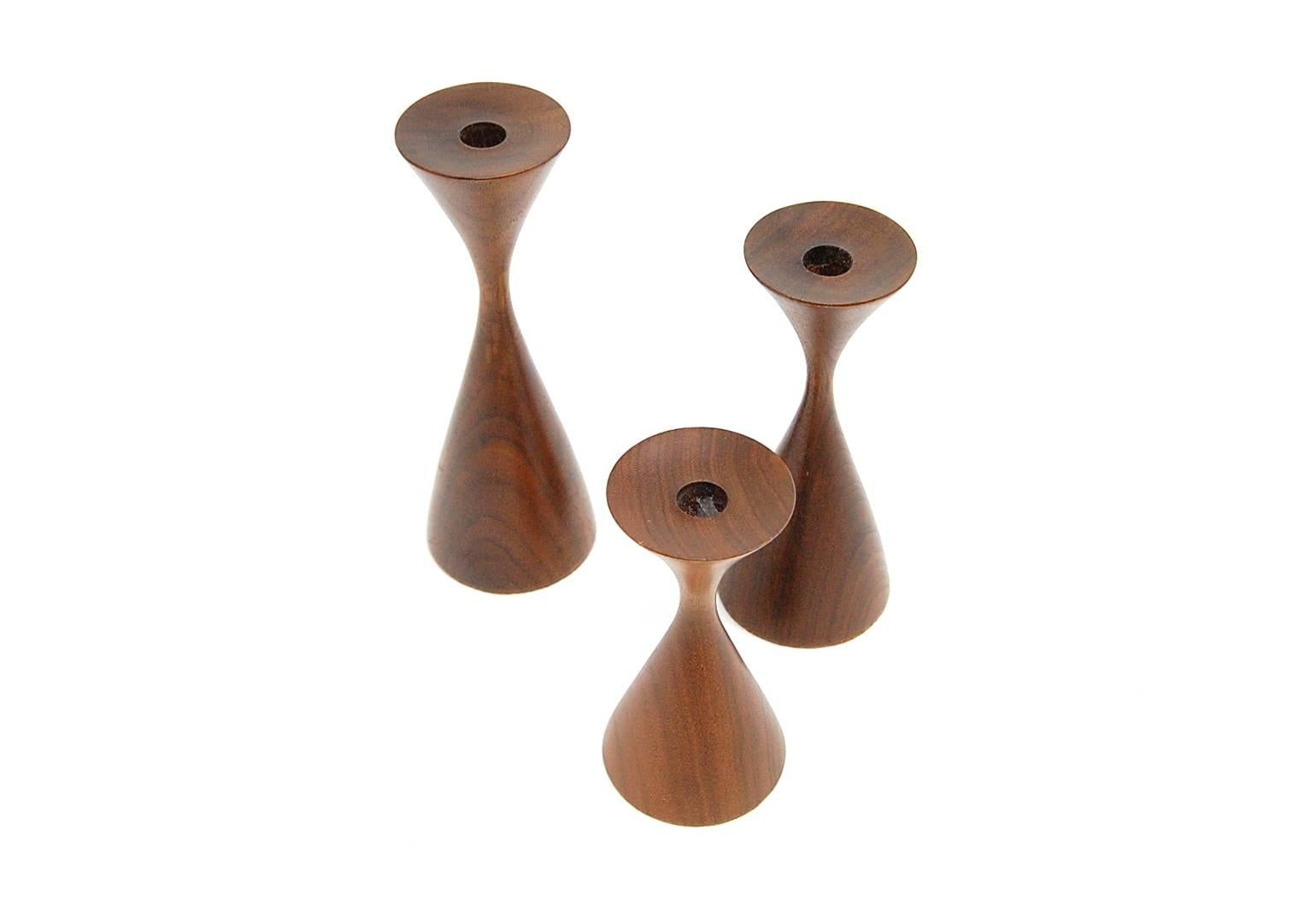 Trio of Rude Osolnik walnut candlesticks. Largest one stands 6 3/8