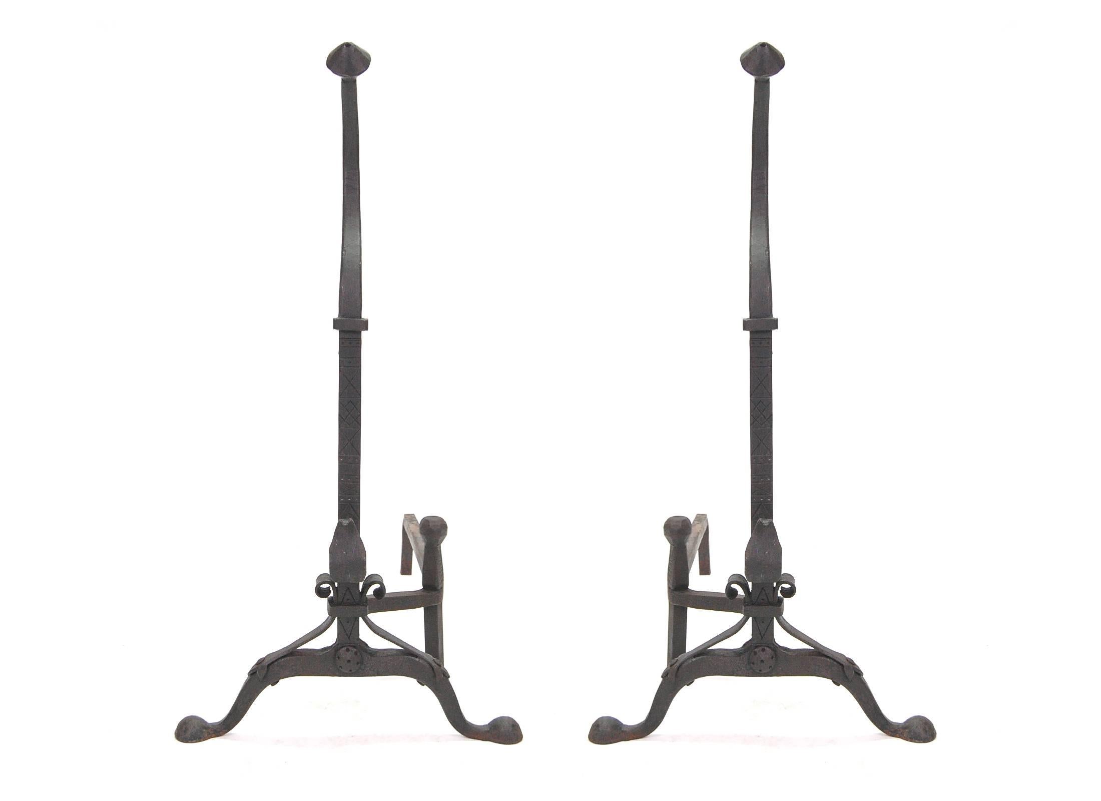 Beautiful pair of hand-forged Andirons, circa 1928, American. Obviously crafted by a highly skilled blacksmith, these andirons have great scale and proportions and the quality is top notch, with crosshatching up the front of the main body and hand