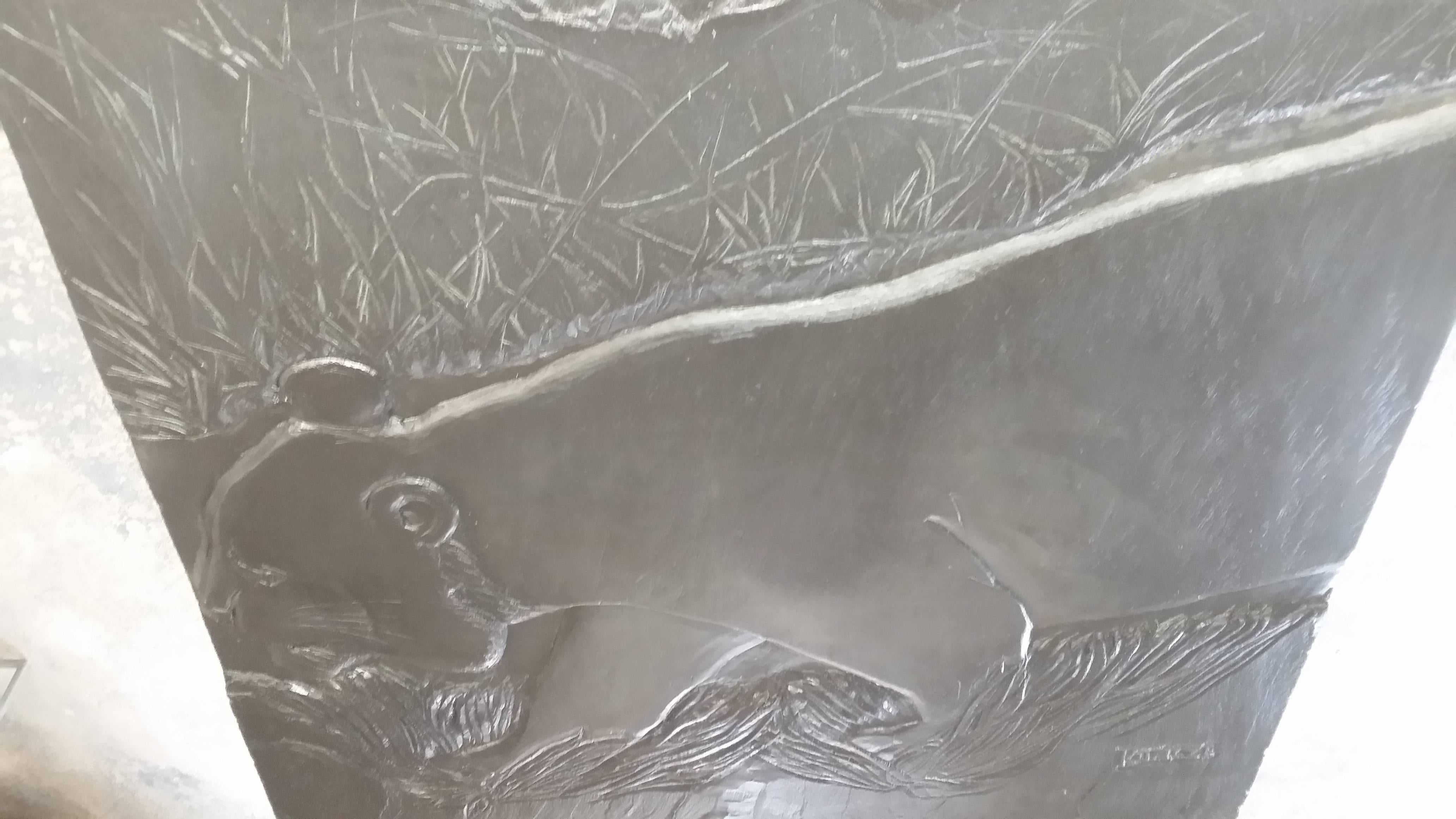 Large bas relief sculpture on a solid slab of 3/4