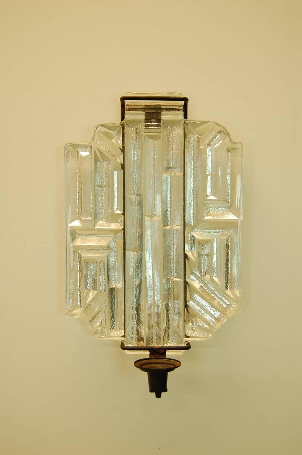 Single glass and steel wall sconce, circa 1965. Most likely Scandinavian in origin. Holds a single candle. The glass is 1 1/4