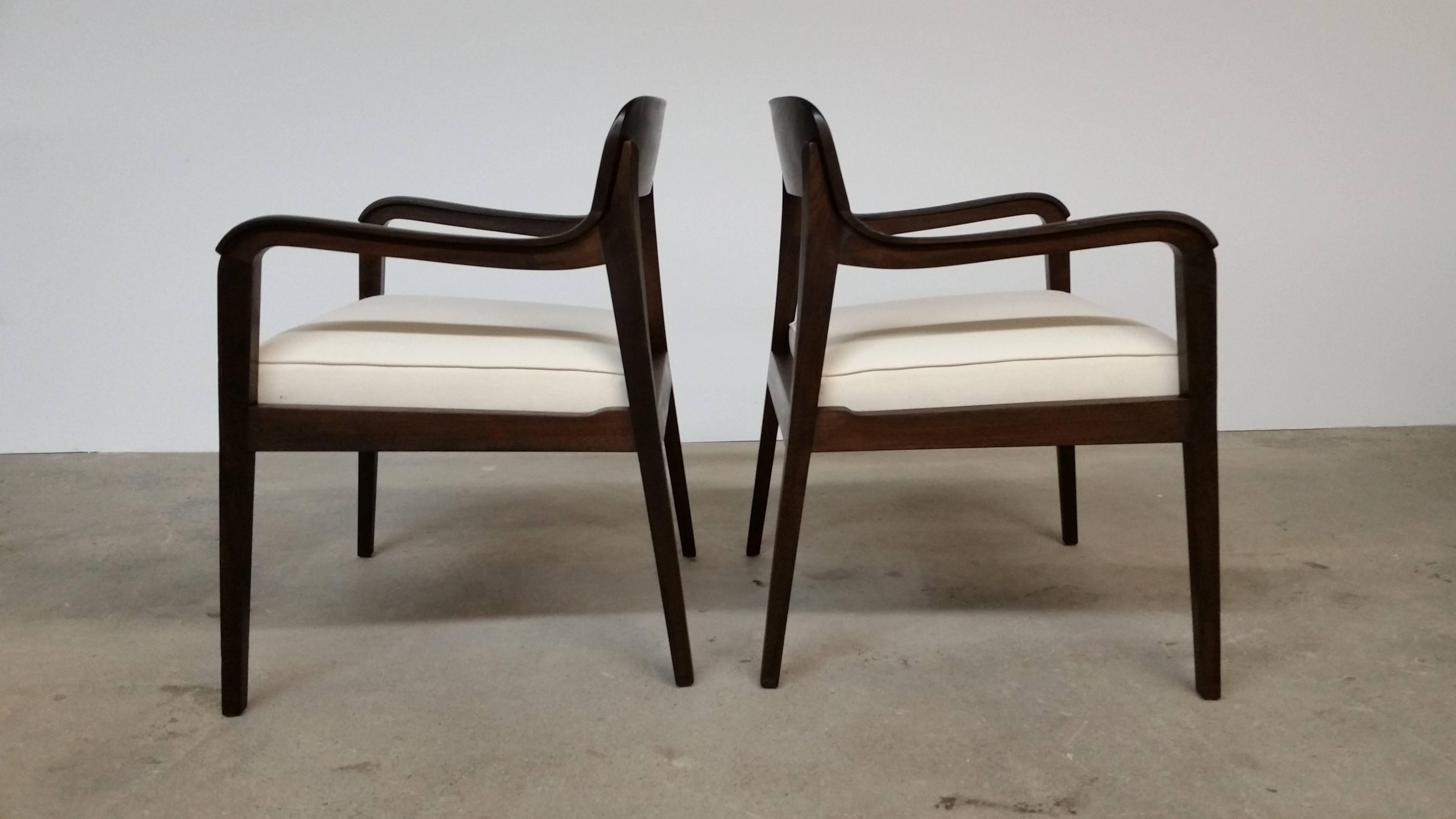 Pair of Riemerschmid chairs, circa 1955, designed by Edward Wormley and produced by Dunbar. Newly reupholstered and refinished. Walnut. 19