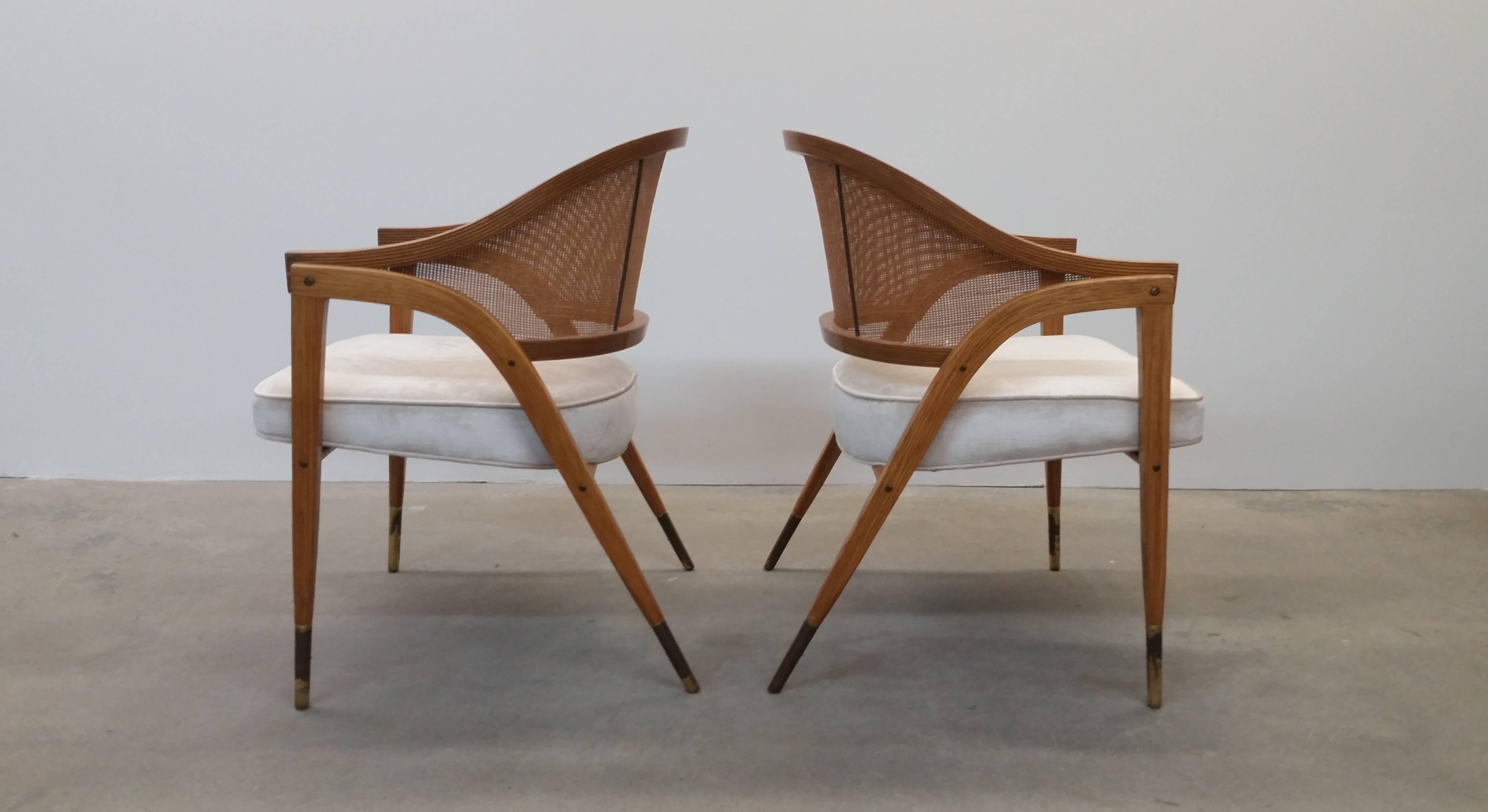 Pair of Dunbar model number 5480 chairs in ash and brass, circa 1962. Arguably one of Wormley's best designs. Newly upholstered in an off white cut velvet. New foam was installed during re-upholstery process. Brass sabots show patina/tarnish, but we