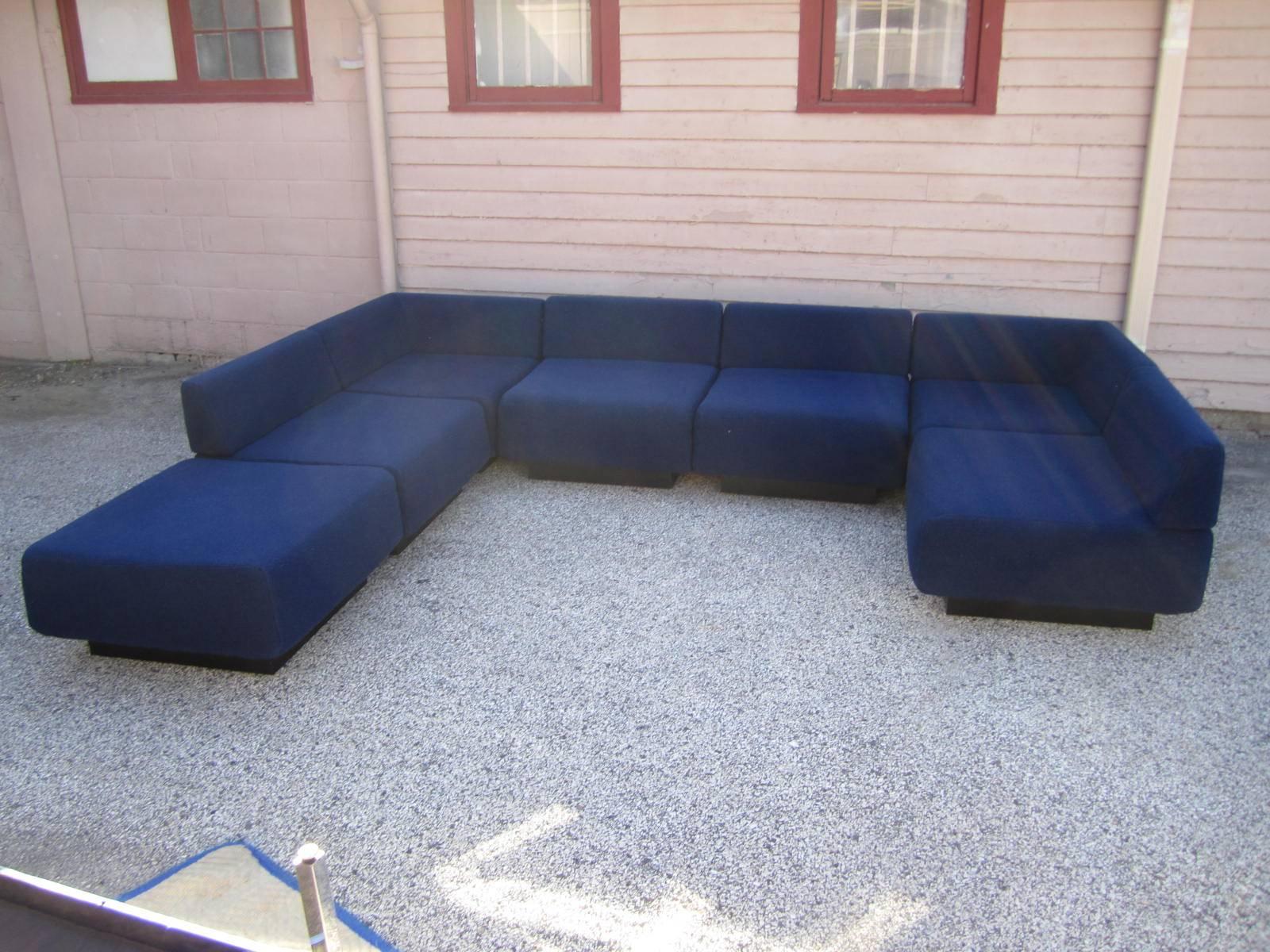 Cubo sectional sofa designed by Harvey Probber. Measurements are per piece. Seven sections comprised of, four straight, two corners and one ottoman. Measures: Seat height 16