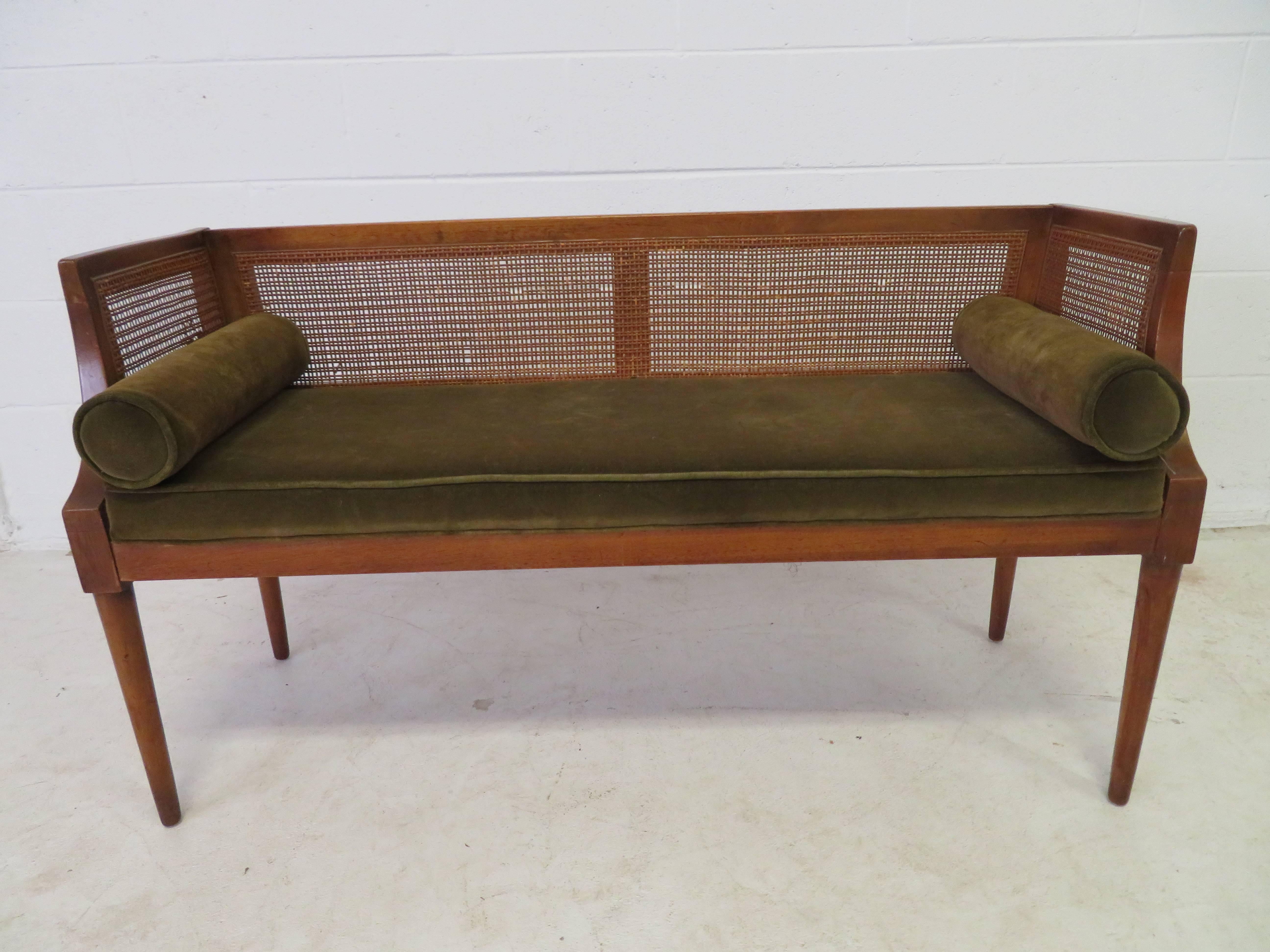 Handsome Danish modern caned window bench with two cylinder pillows. This piece will need to be re-upholstered but that's what you designers are looking for any way-right?