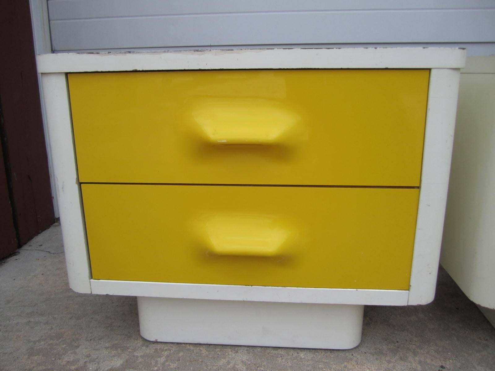 Space Age injection molded plastic drawer fronts. White laminate top over lacquered case. In very good condition. Manufactured by Broyhill, well crafted design. You will love these colorful piece in the bedroom or any living space.