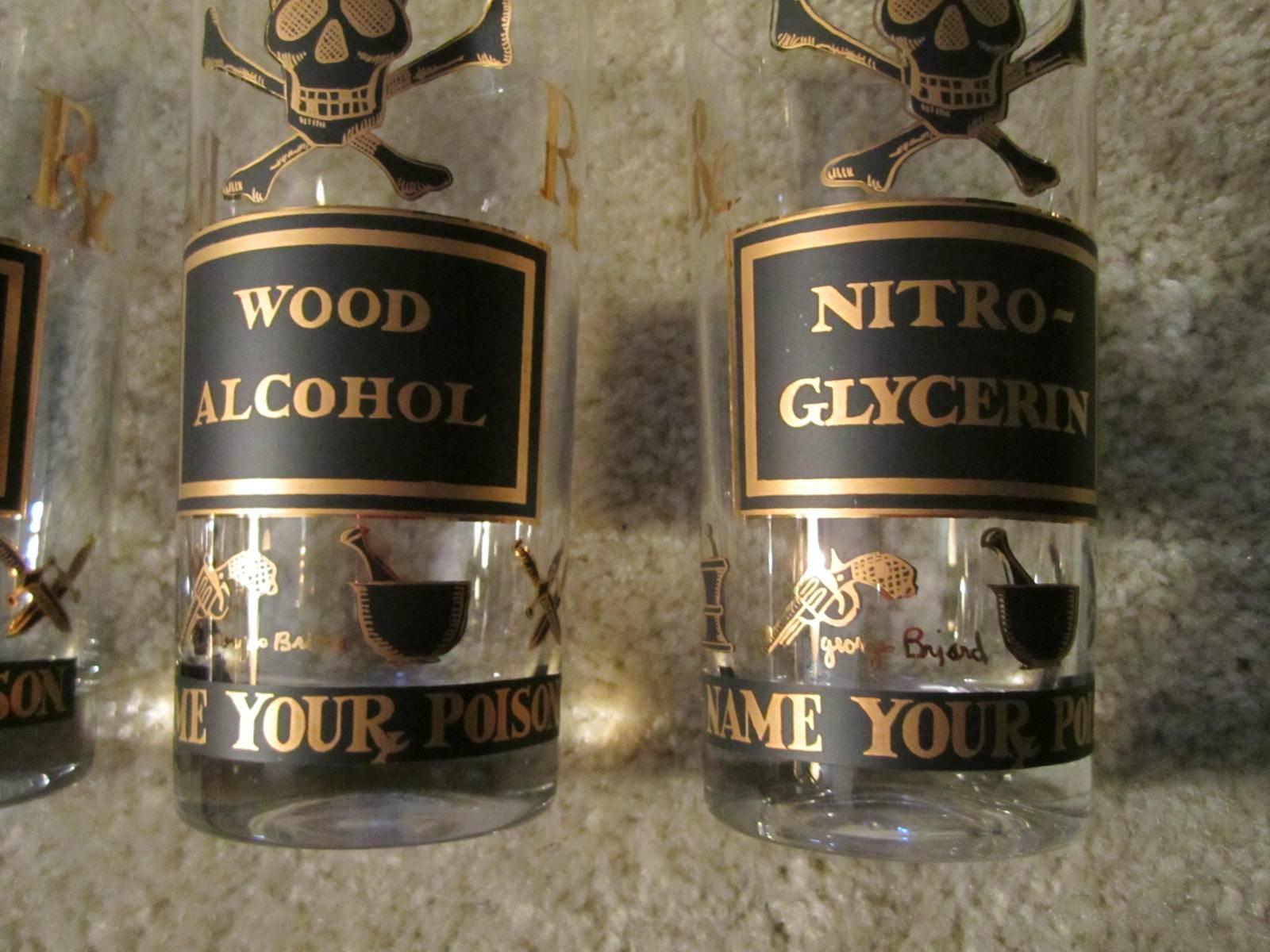 A cool Mid-Century novelty cocktail set by Georges Briard. Each high ball glass is emblazoned with a skull and crossbones motif and the name of a particular poison in black and gold overlay. Poisons include: Iodine, wood alcohol, nitro-glycerin,