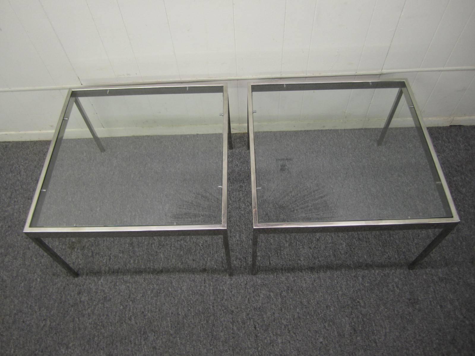 Handsome  pair of chrome and glass Milo Baughman side end tables.  Very simplistic heavy chrome frame with new glass.  