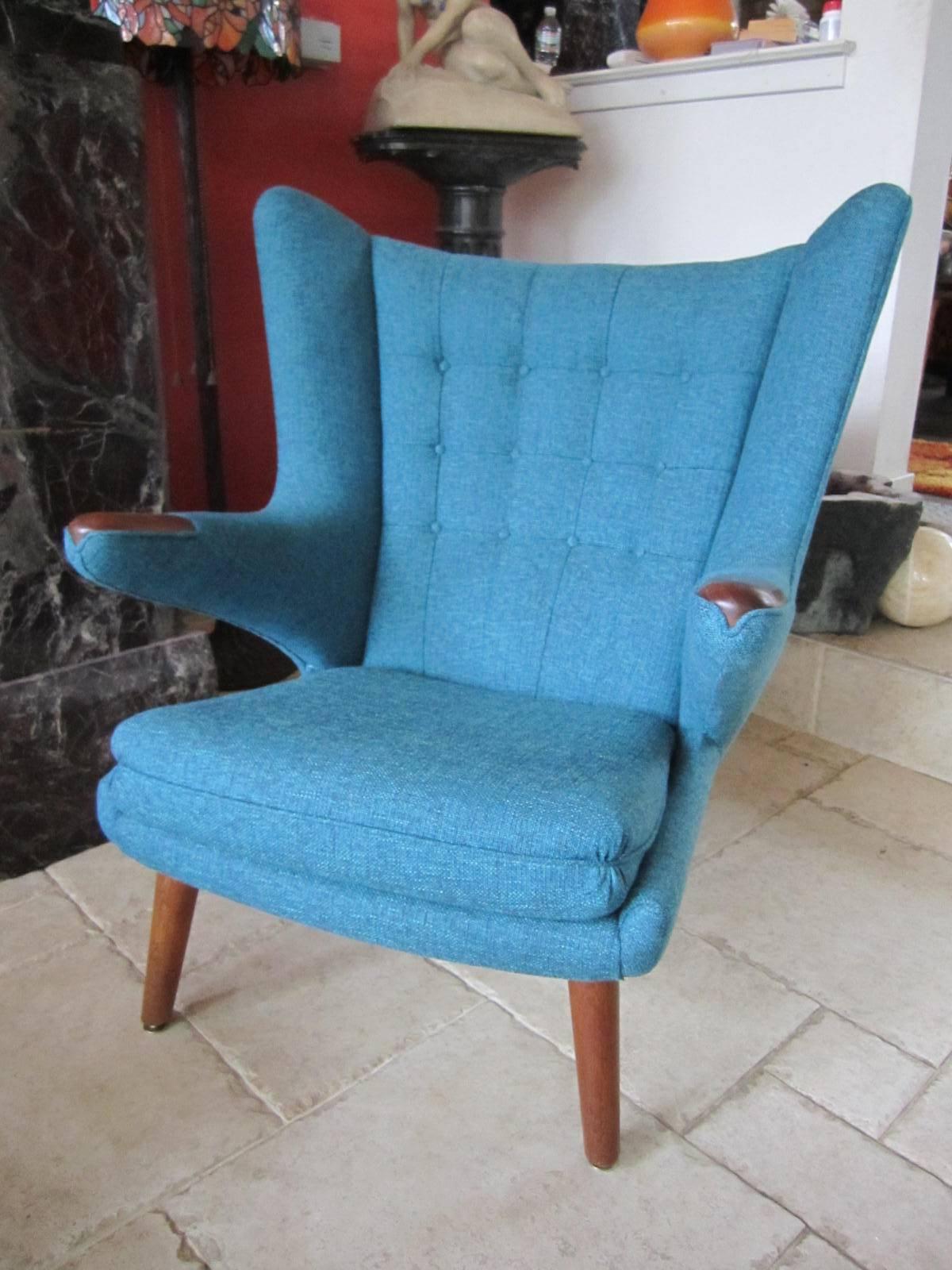 Iconic vintage modern Papa Bear chairs with fabulous new upholstery, widely celebrated design (AP19) by AP Stolen dates back to the 1950s. This example is in pristine condition with brand new high-end woven deep turquoise fabric. The original owners