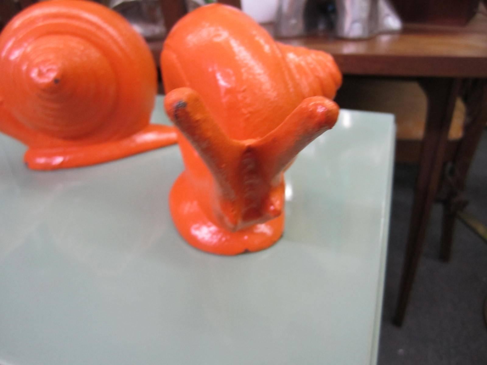 Mid-20th Century Whimsical Pair of Cast Iron Painted Orange Snail Bookends Mid-Century Modern