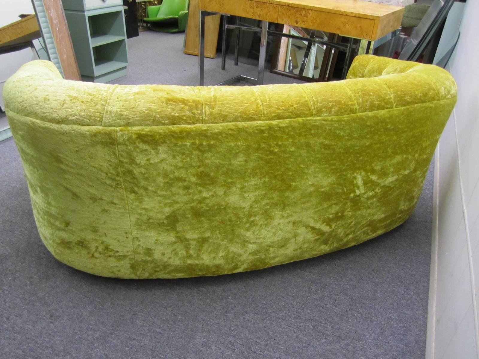 Super swanky pair of golden velvet tufted loveseats. They retain their original golden crushed velvet in very presentable condition. The seats are ultra low at close to 14