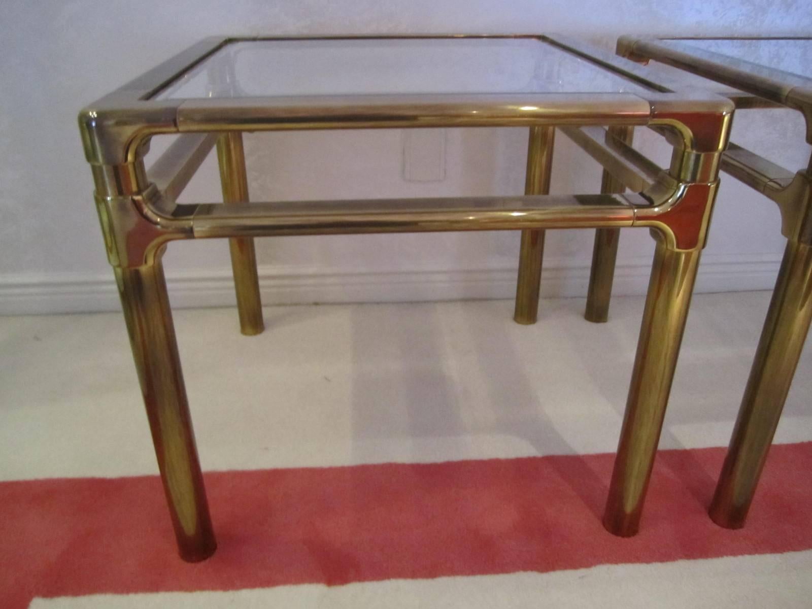 Lovely pair of Mastercraft Asian style thick brass side tables. These tables are in nice vintage condition and have acquired a perfect antiqued brass look. There are 2 small dings to one of the tables-not distracting.