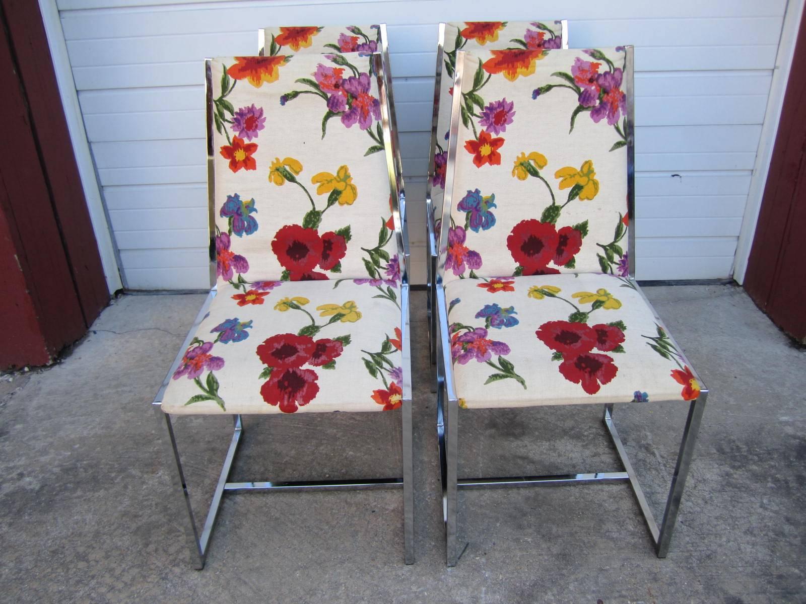 Lovely set of four Milo Baughman style chrome dining chairs. This set was reupholstered in the 1970s with a fantastic floral linen-needs cleaning. The chrome has a mirrored finish and still looks great. Perfect set for those smaller areas.