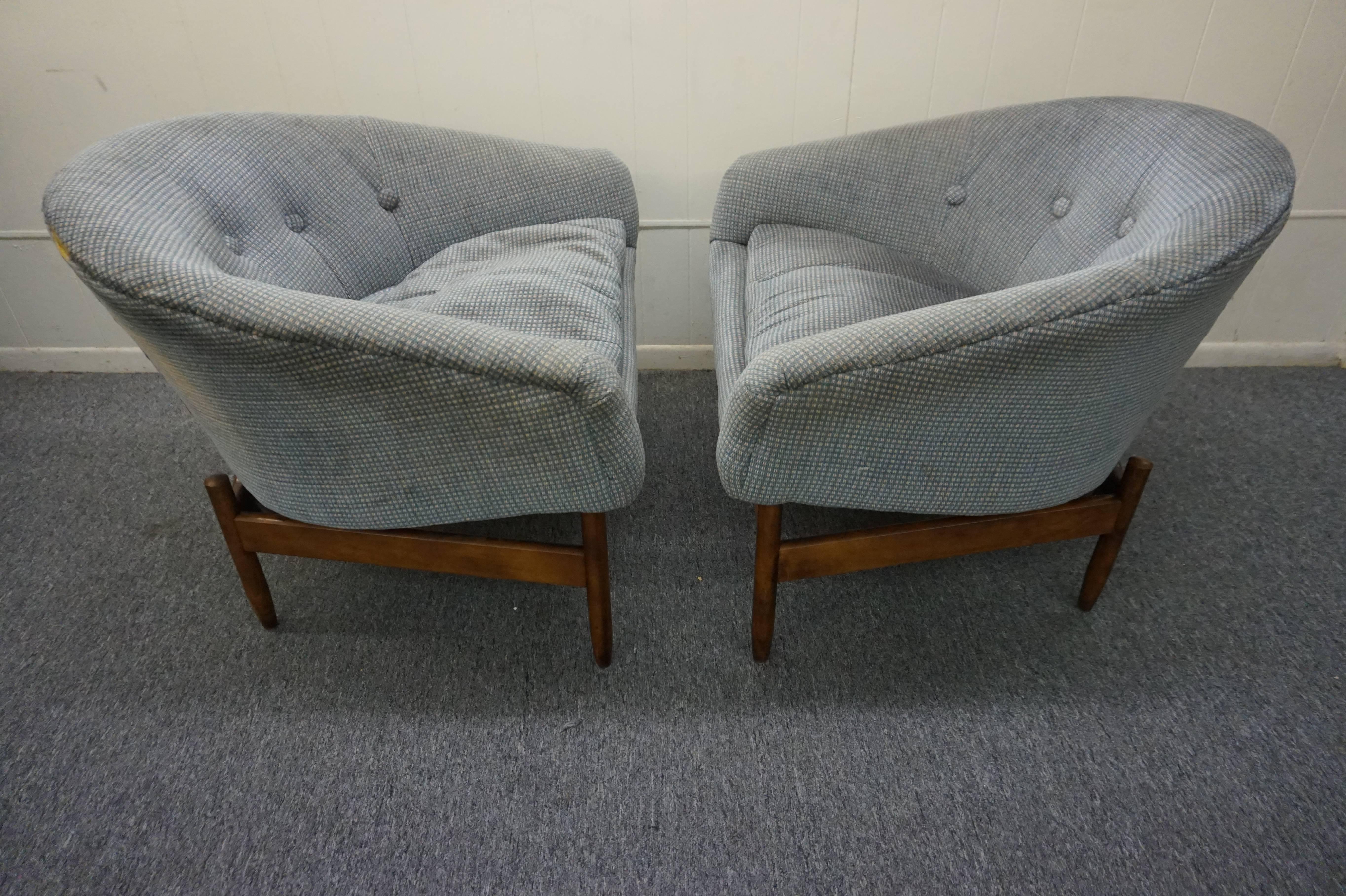 Very uncommonly seen pair barrel back chairs designed by Lawrence Peabody. They features a sculptural walnut base and Classic barrel back tub chair design. The chairs are structurally sound but needs to be re-upholstered.
