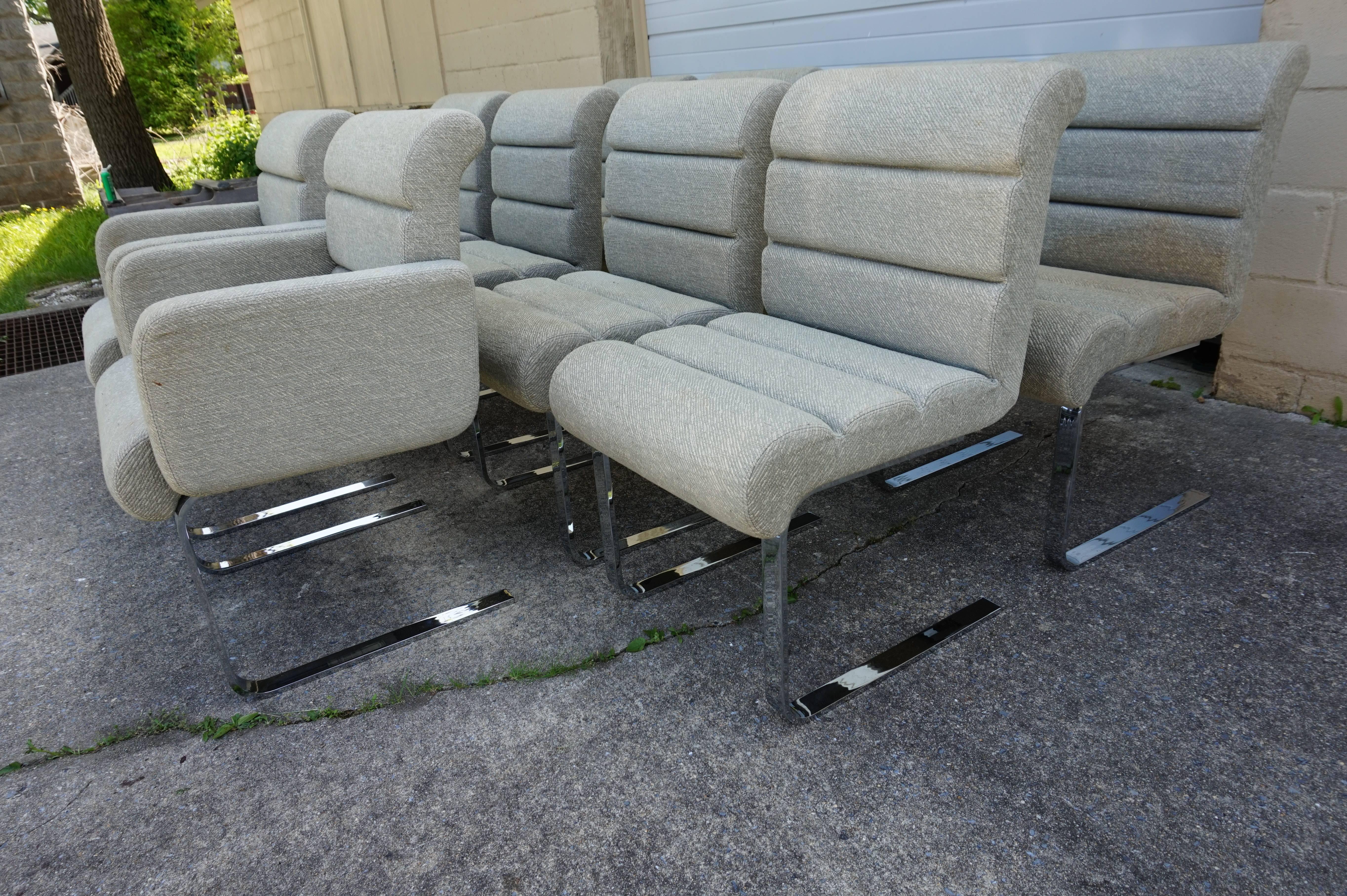 Large set of ten Mariani Laguna Pace Collection cantilevered chrome dining chairs. The chairs retain their original fabric which will need re-upholstery. Heavy steel frames are in excellent condition with only very minor wear. The two armchairs