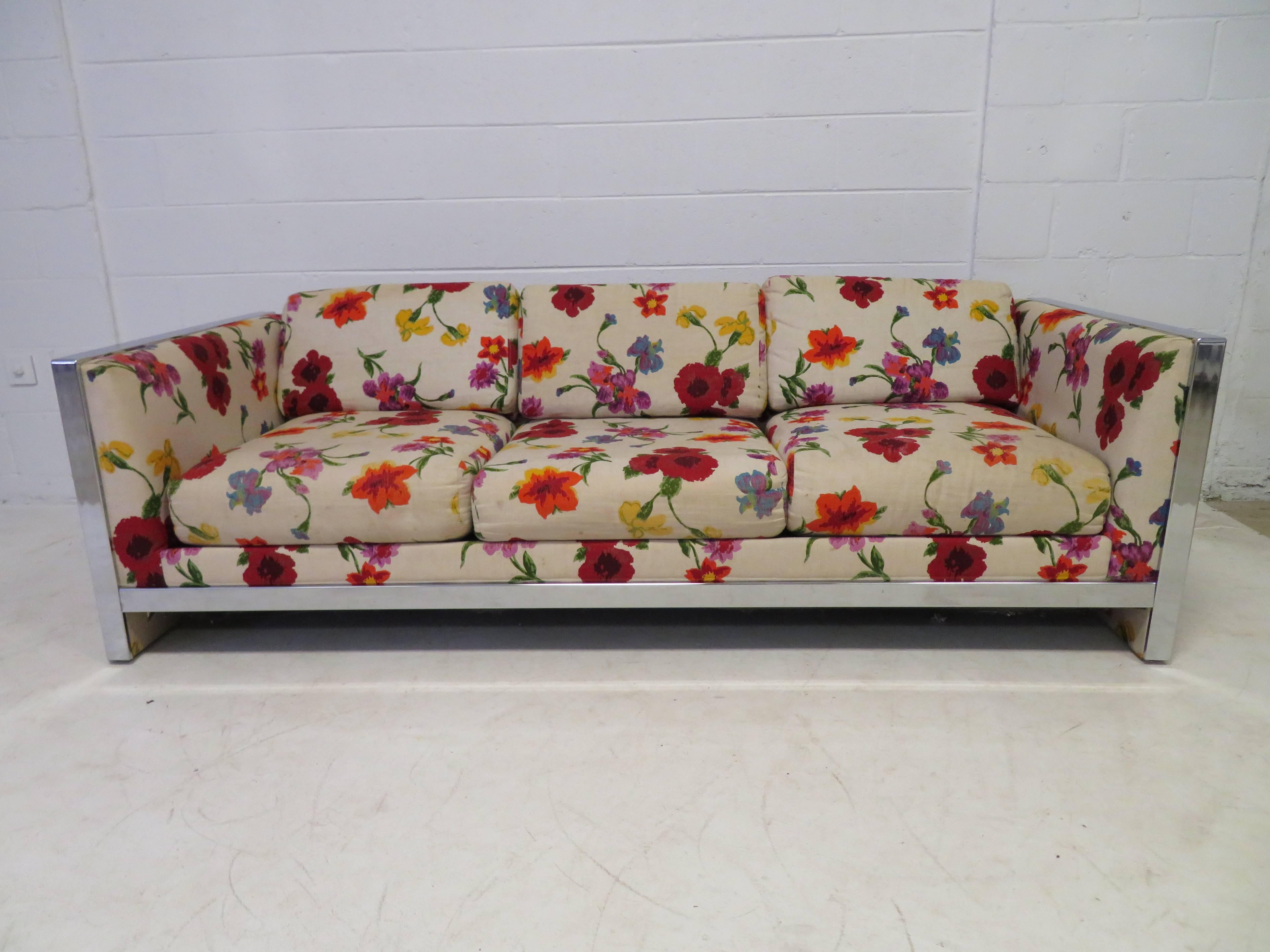 Lovely Milo Baughman style chunky chrome Mid-Century Modern sofa. Looks like the sofa was reupholstered in the 1980s with a wonderful floral linen in nice vintage condition-minor wear. We have the matching loveseat listed in another of our 1stdibs