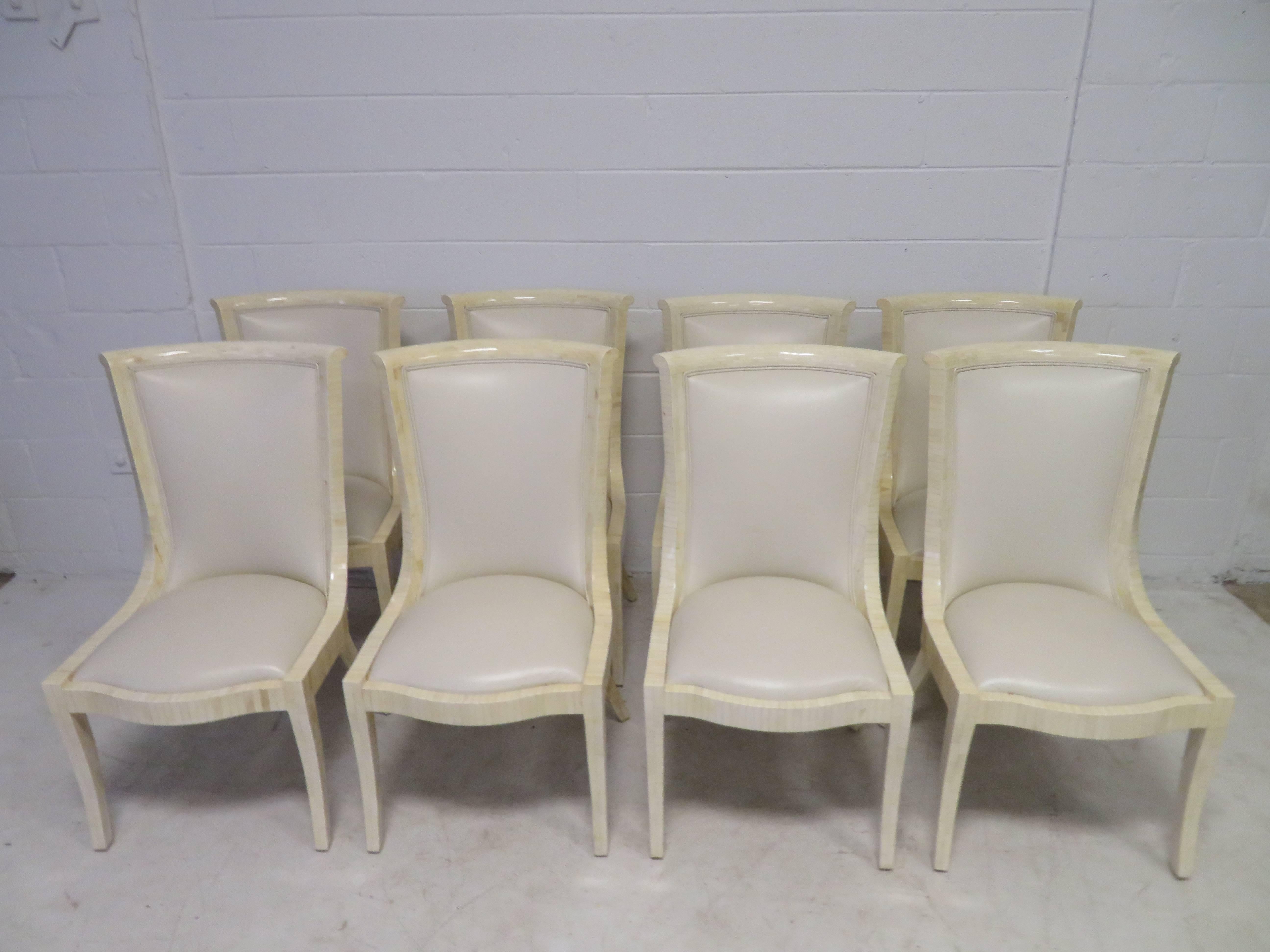 Outstanding set of Enrique Garcel tessellated ivory bone dining chairs with original leather upholstery. This set is in fantastic vintage condition and is rare to find a set so large. Set consists of two armchairs and eight sides.
