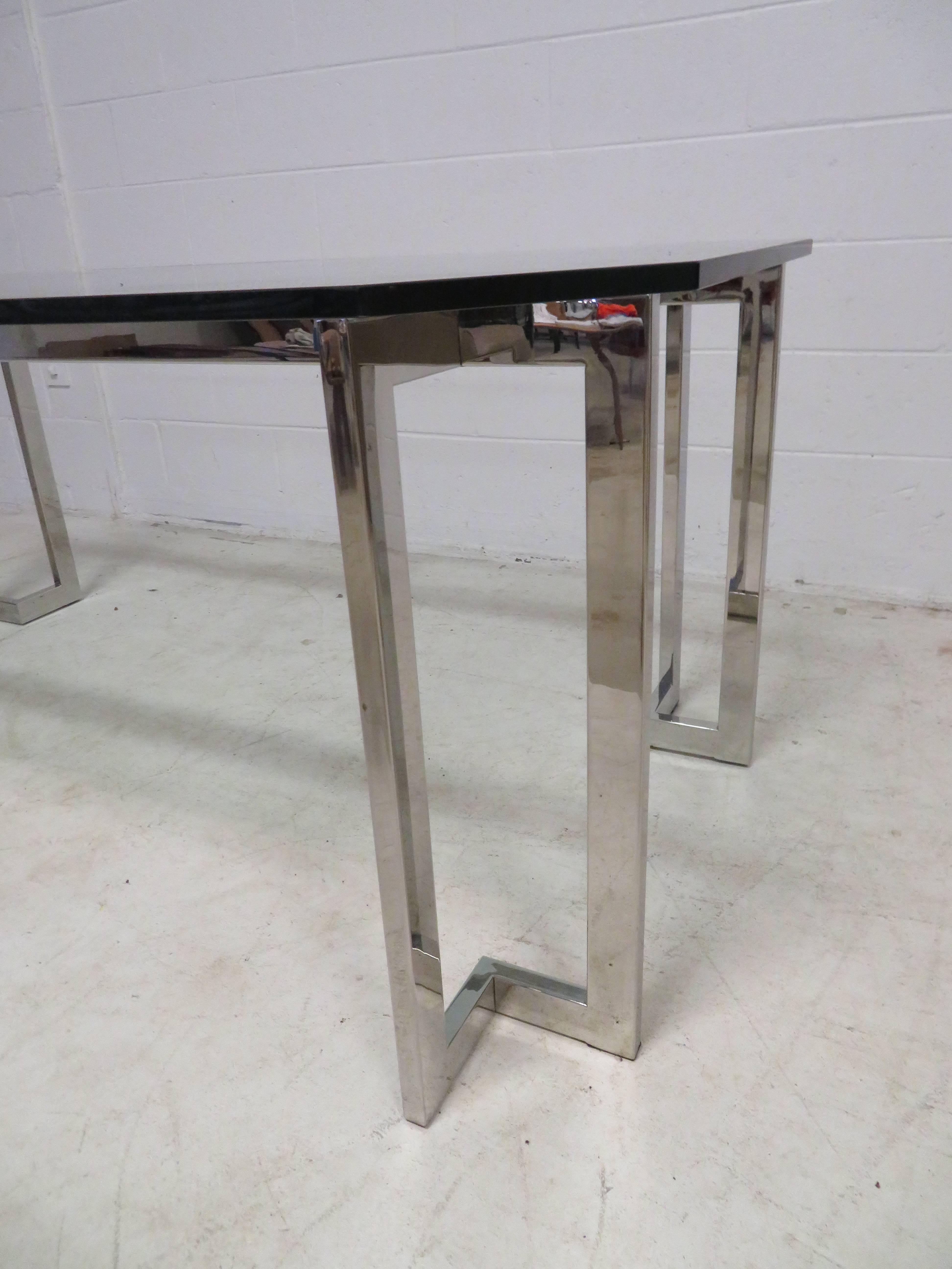 Fantastic Milo Baughman style chrome and glass dining table or desk. We love the large-scale chrome tic tac toe chrome base with the super thick glass with angled corners. Can be used a s a dining table or desk.