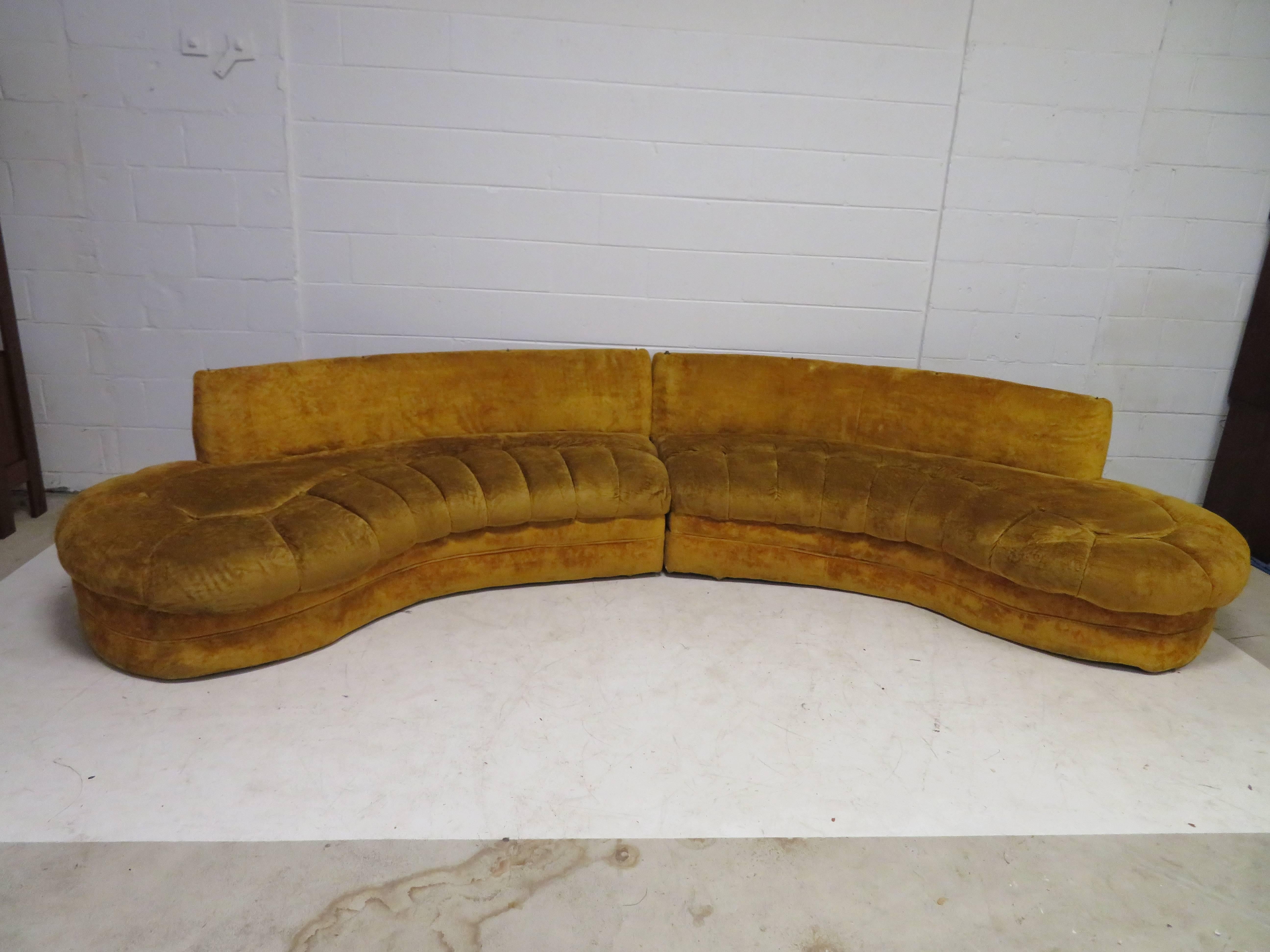 Gorgeous curved serpentine two-piece Adrian Pearsall style sofa sectional. This set will definitely need to be reupholstered but that's what you designers are looking for right? Each piece measures 29
