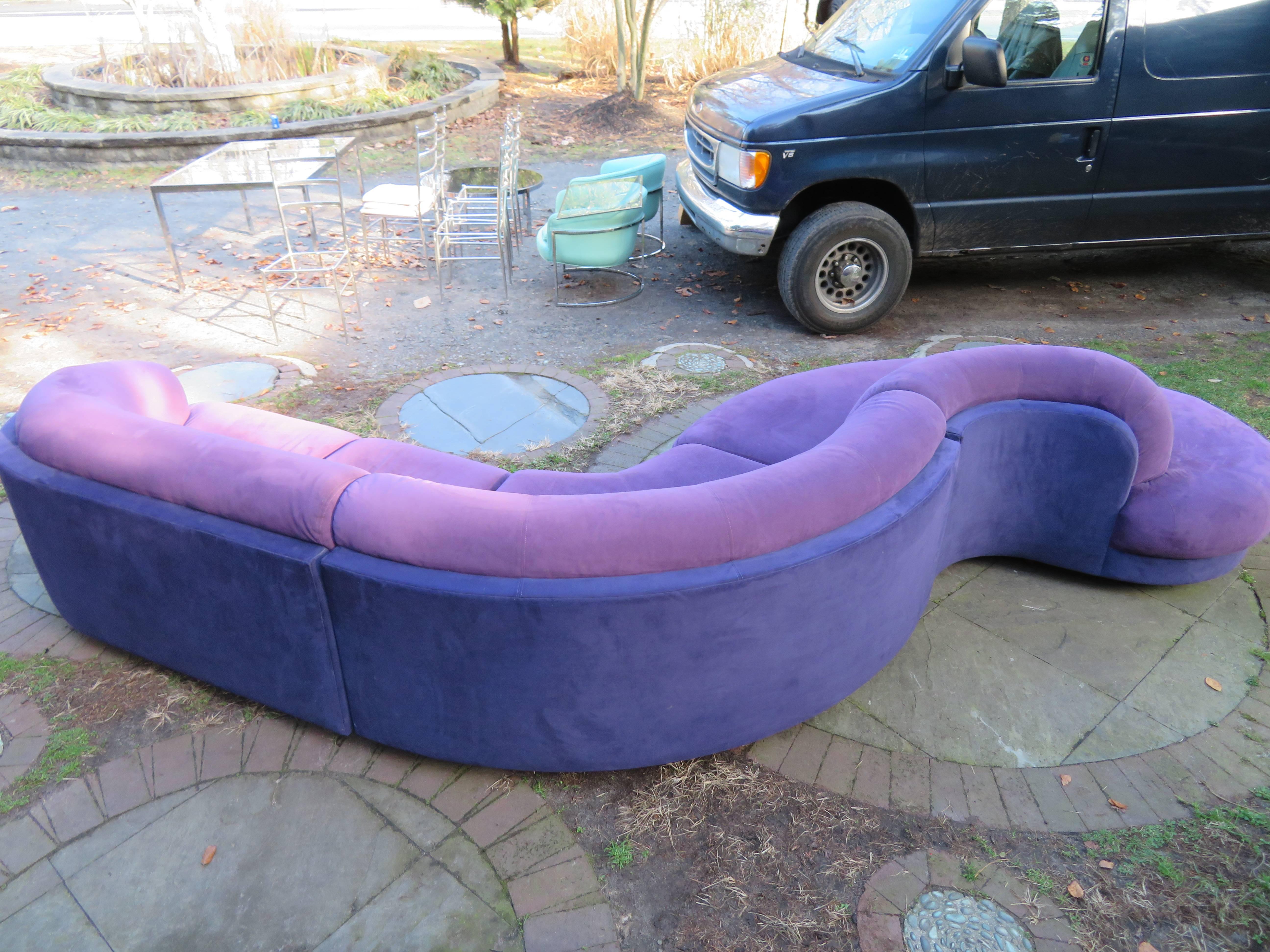 Stunning three-piece Vladimir Kagan serpentine sofa for Weiman. Having gorgeous sweeping sensual lines this sofa is fabulous from every angle. This sofa retains its original two-tone purple ultra-suede with light signs of use-new upholstery is