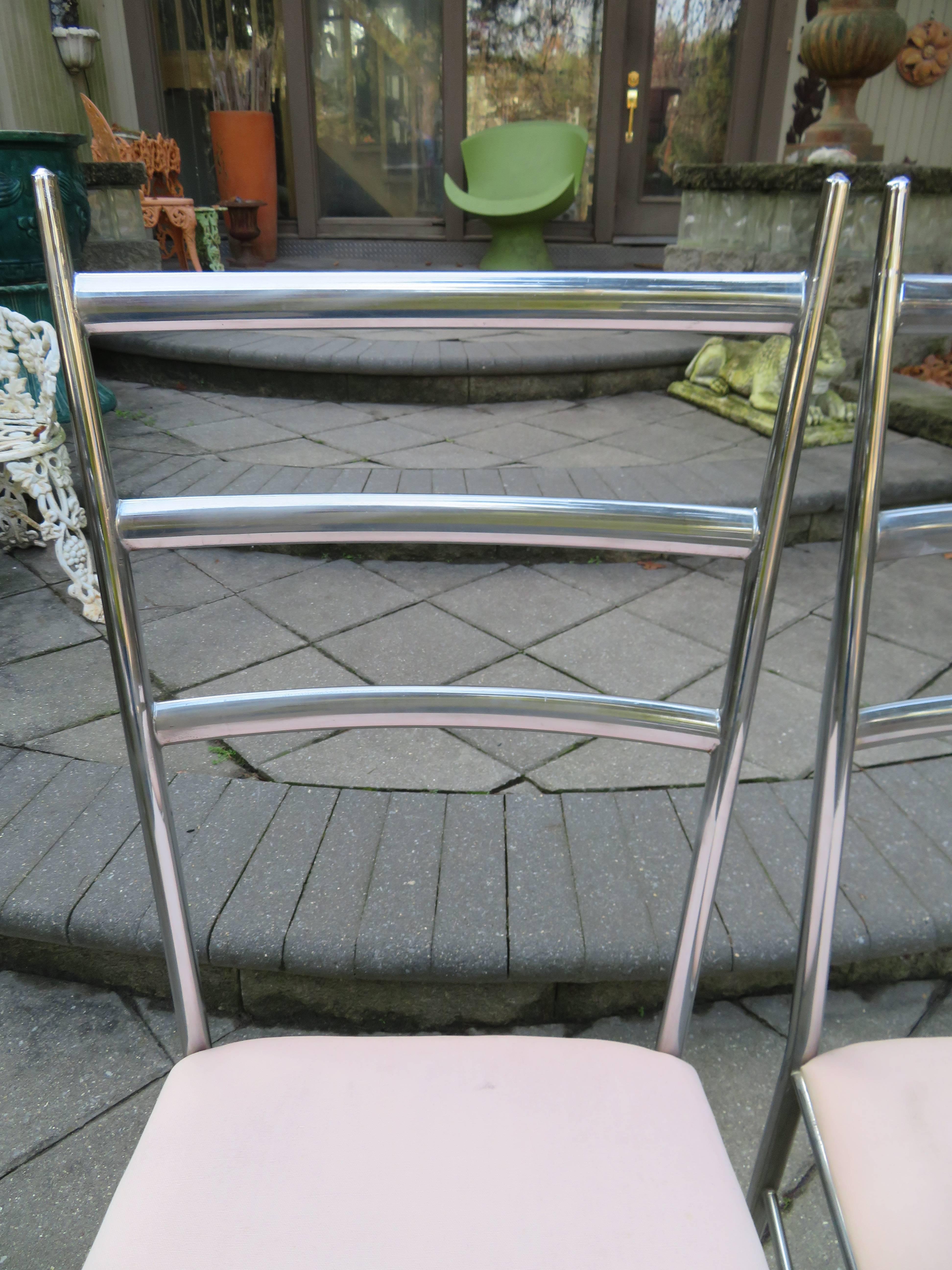 Wonderful set of six delicate, chrome ladder back dining chairs. Chairs are in the style of Gio Ponti. Chrome frame is in nice vintage condition and of beautiful craftsmanship. The seat pads are ready to reupholster in your favourite fabric. Milo