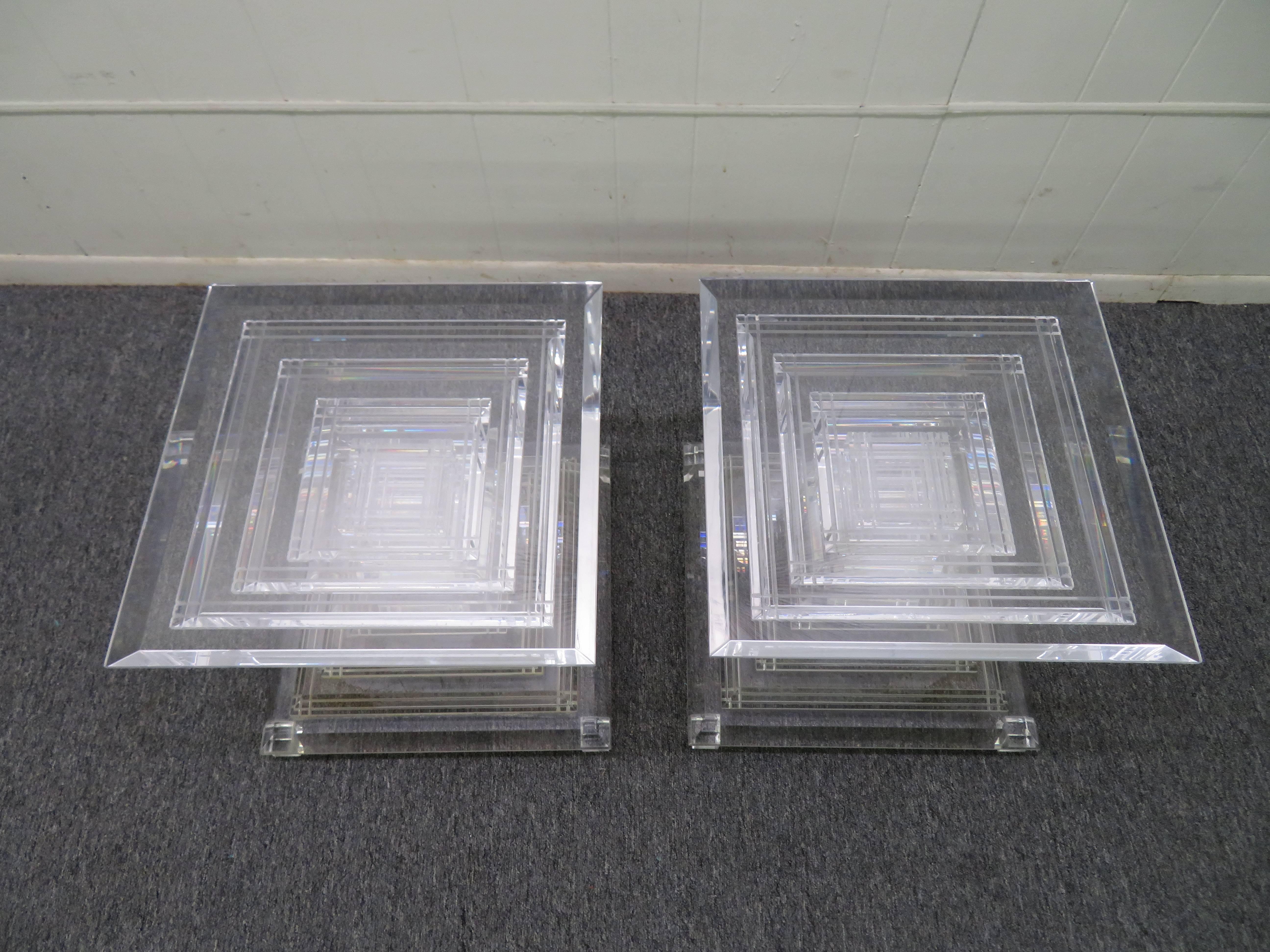 Stunning pair of Karl Springer style stacked Lucite end tables. This pair will add glamour to any decor can be used as separate side tables or used together to make bases for a coffee table.