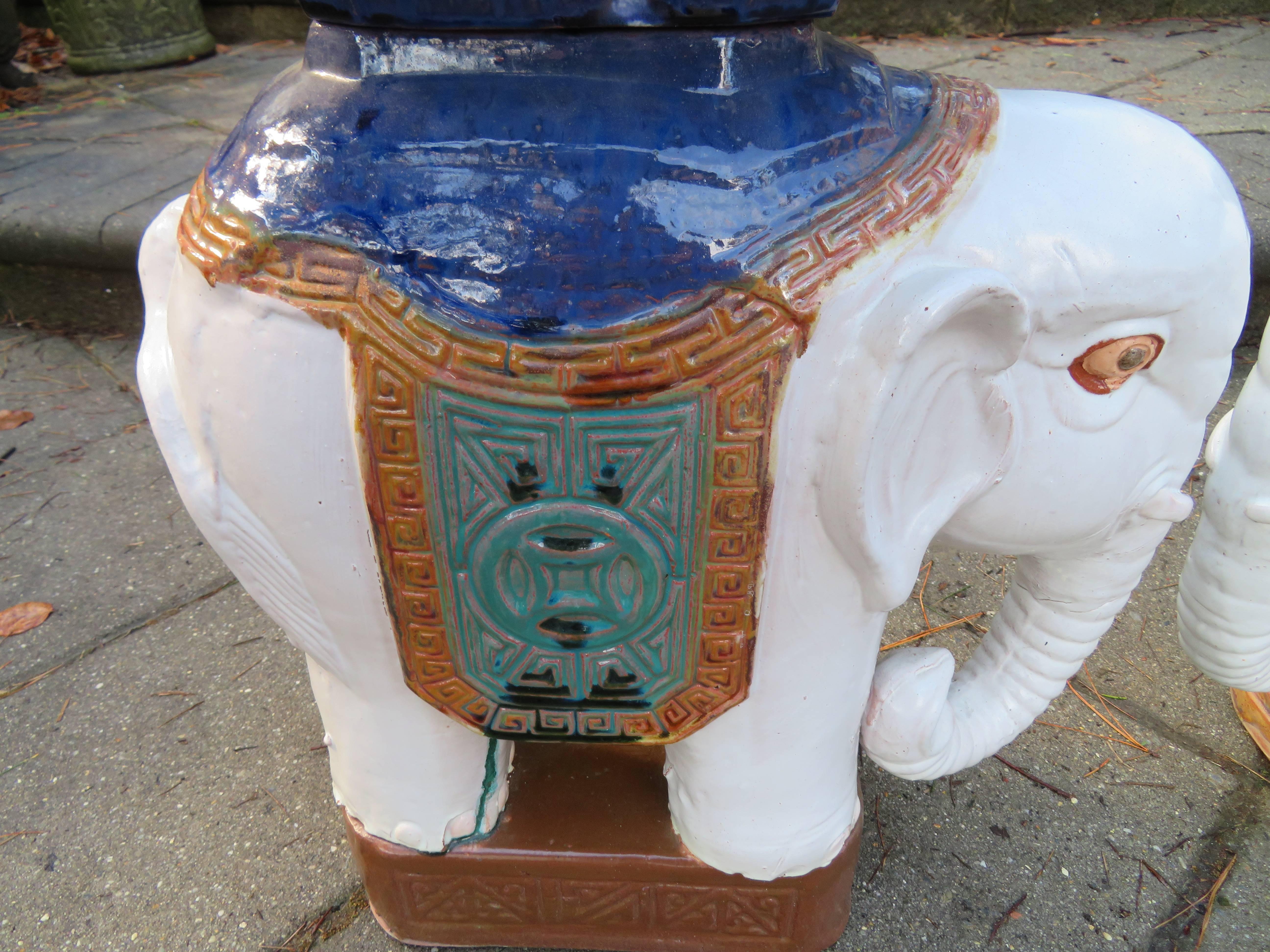 Whimsical pair of glazed terra cotta elephant stools or tables. We love the petite size and low-luster glaze on this cute pair.