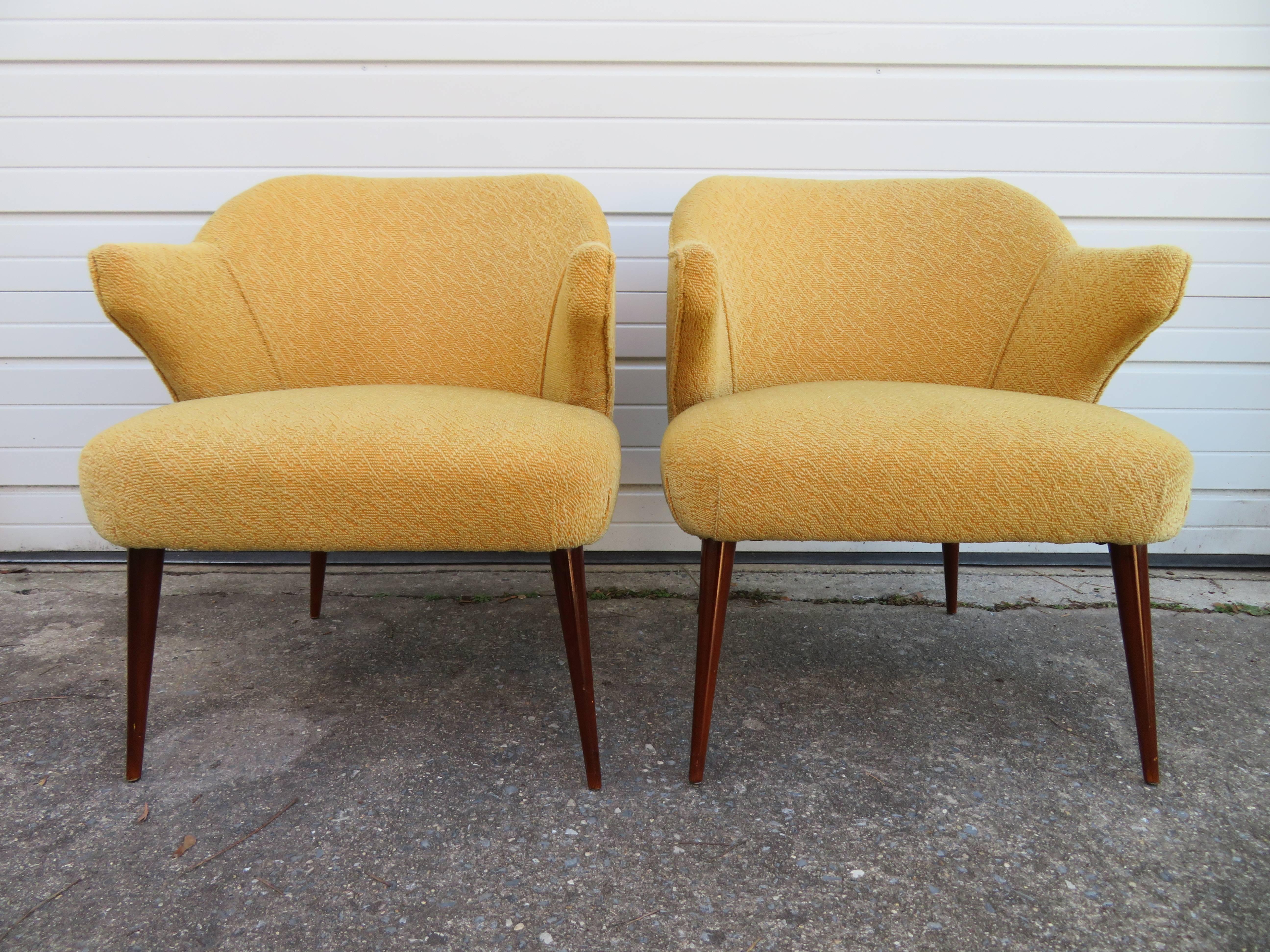Stunning pair of Hans Olsen style teak lounge chairs with great looking upholstered arms.
