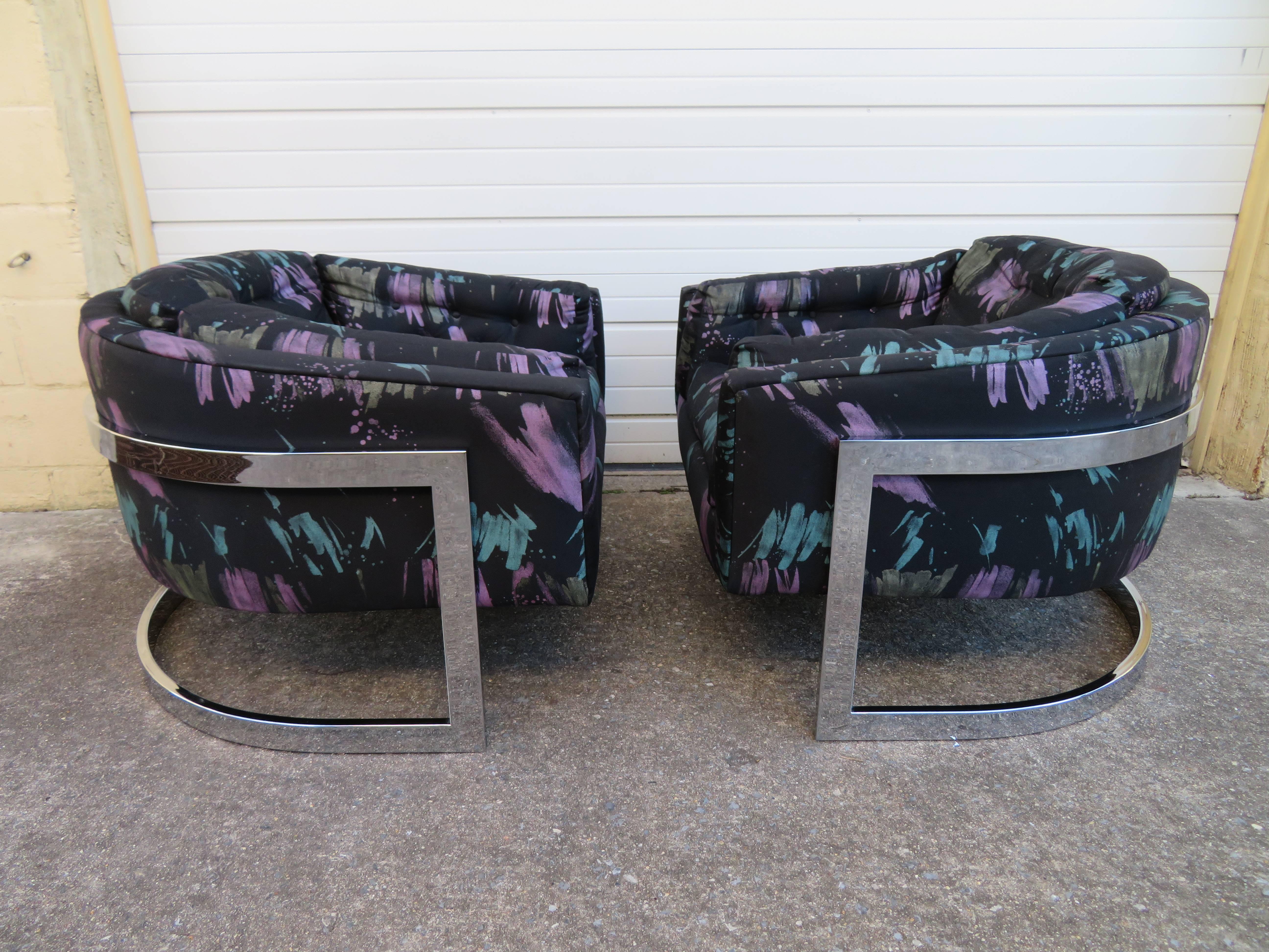Gorgeous pair of Jules Heumann for Metropolitan wide seat chrome barrel back lounge chairs. The original fabric is dated and shows some wear to arms-reupholstery is recommended. The chunky thick chrome frame looks great with great mirrored finish.